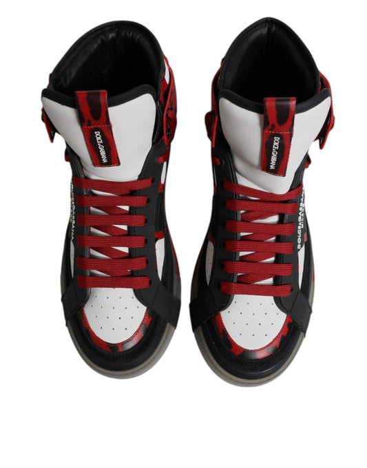 Red and black high top sneakers with white laces, featuring a leather upper and a red stripe on the side