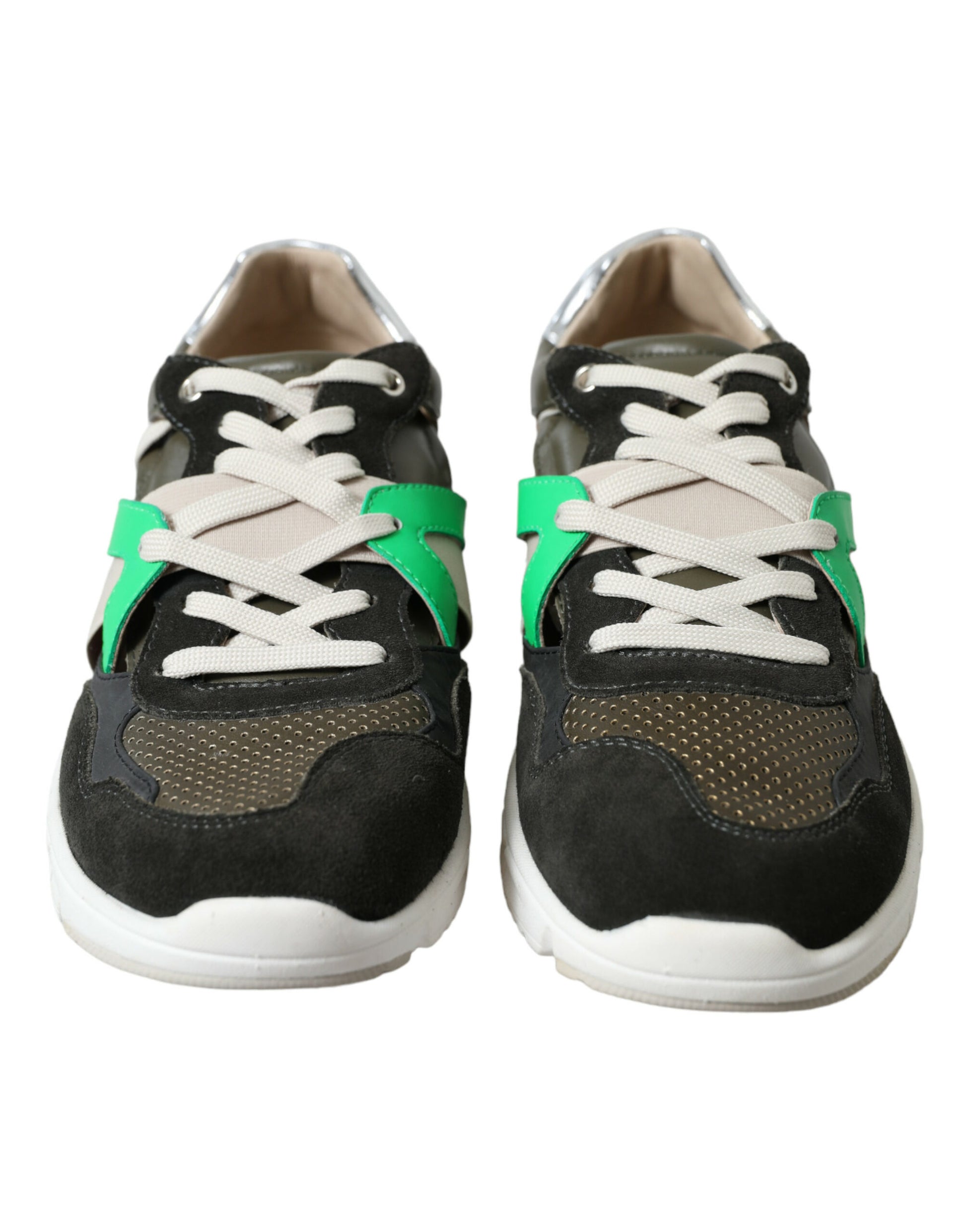 Pair of black and white sneakers with green accents