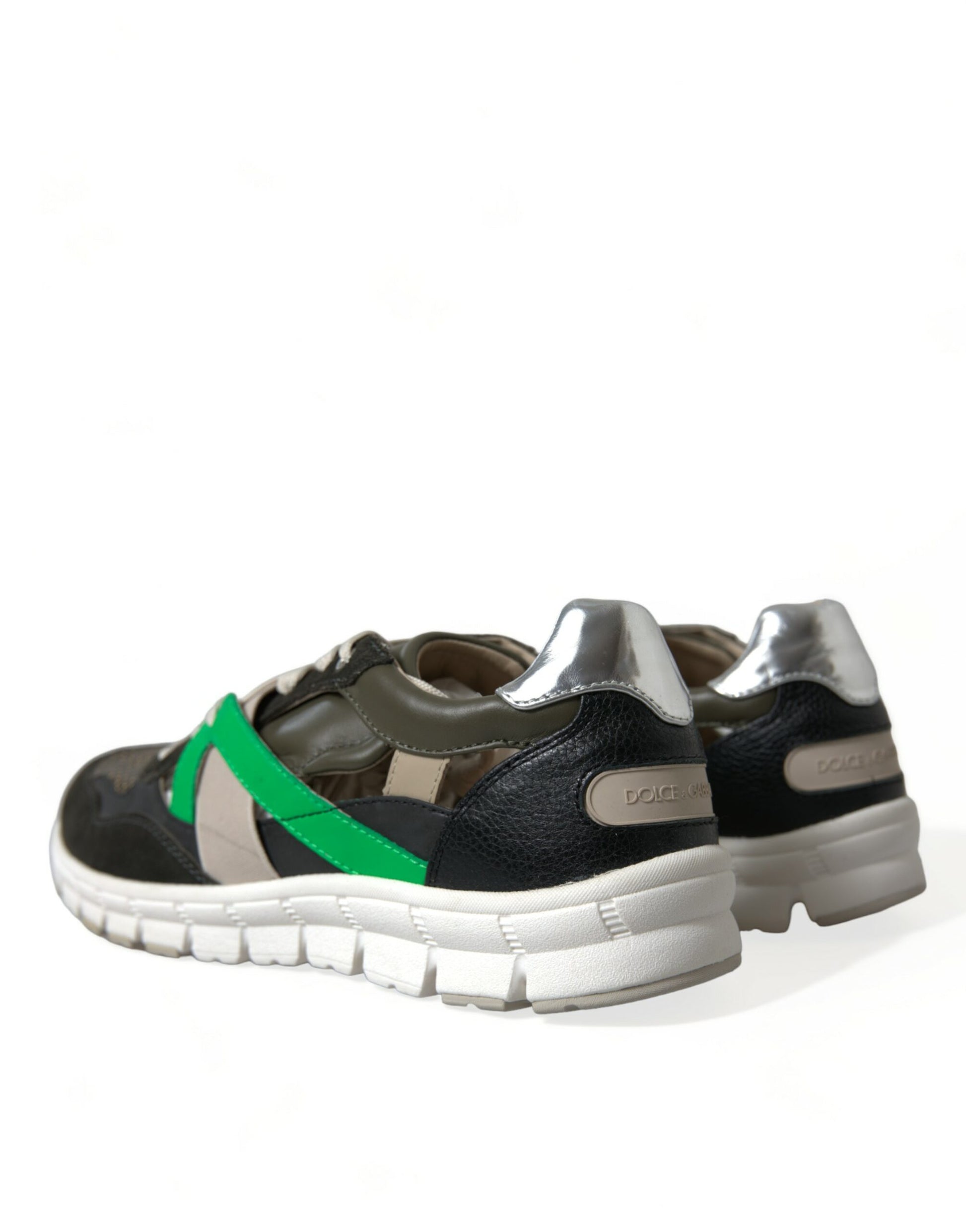 Pair of sneakers with green and black laces