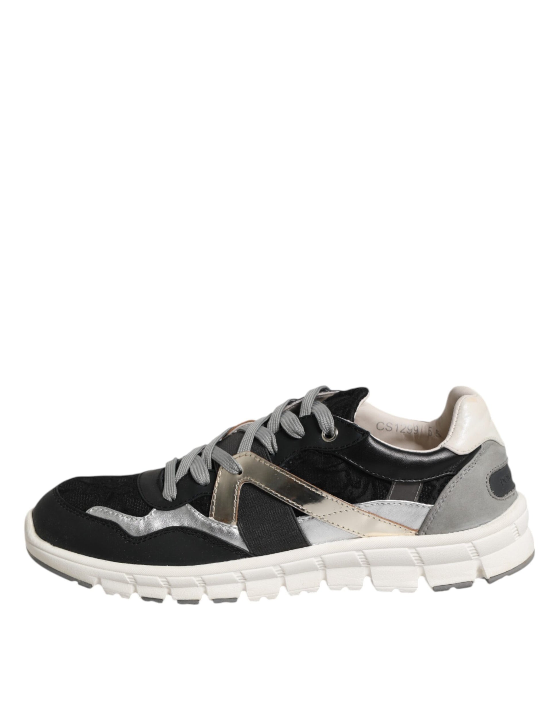 Black and white sneakers with gold accents, featuring laces and a low top design