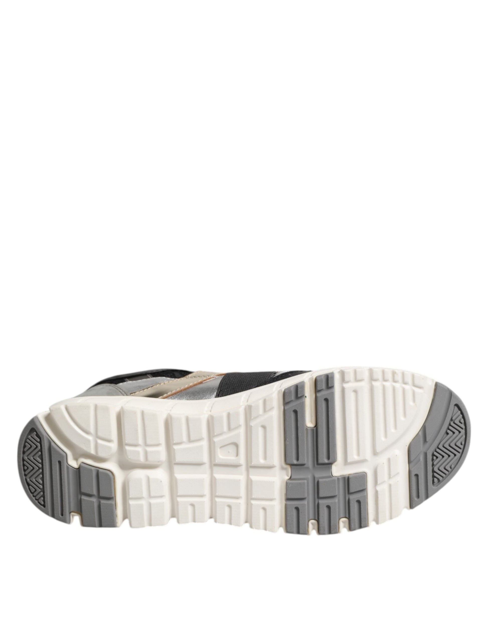 A single shoe with a multicolored design, featuring leather and suede materials