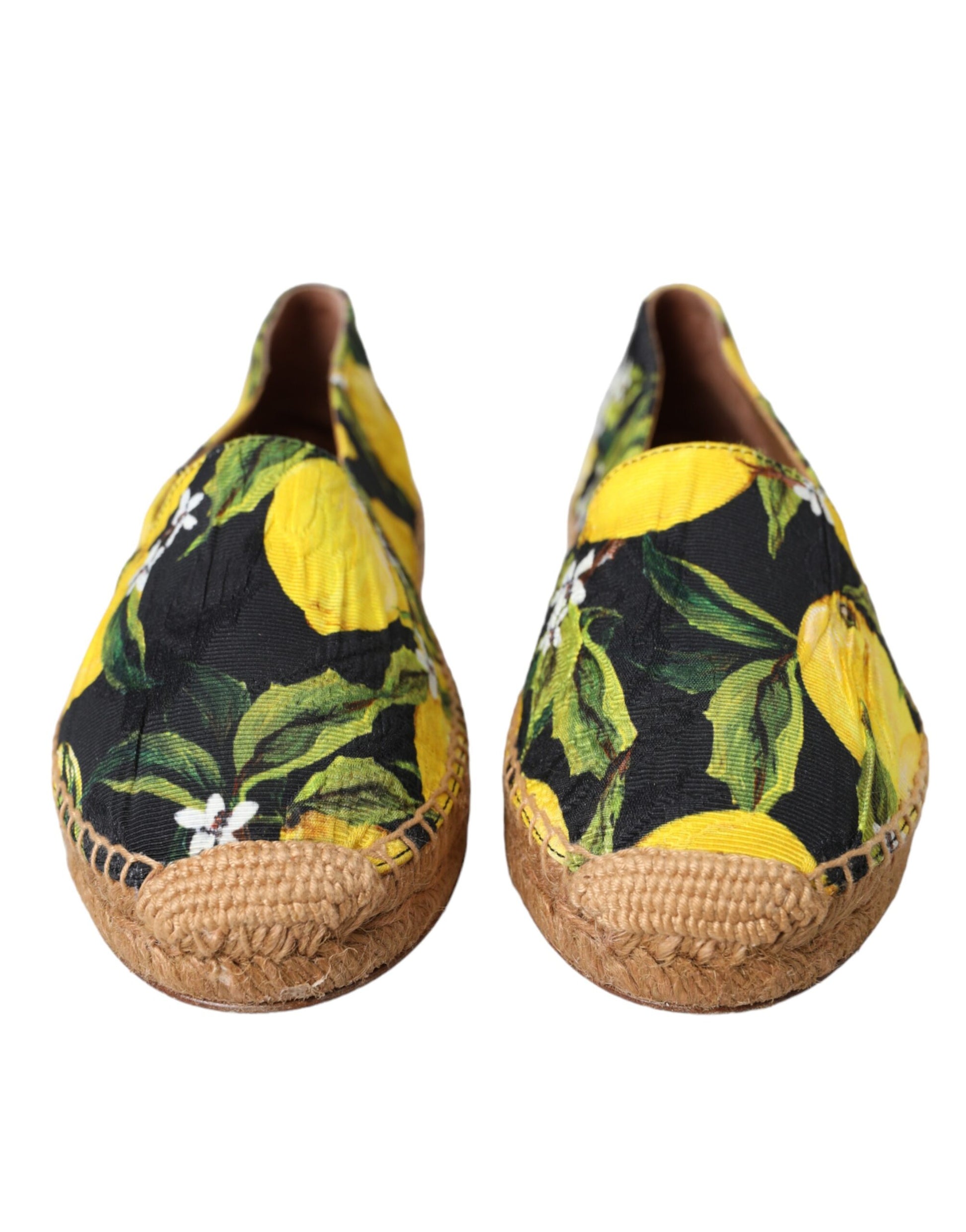 Pair of women's shoes with yellow lemon print on black background