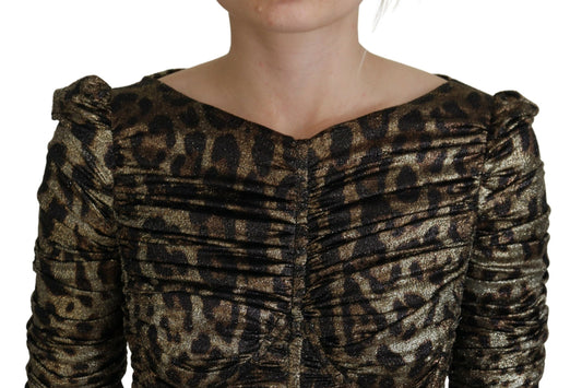 A woman wearing a multicolored leopard print bodycon sheath midi dress