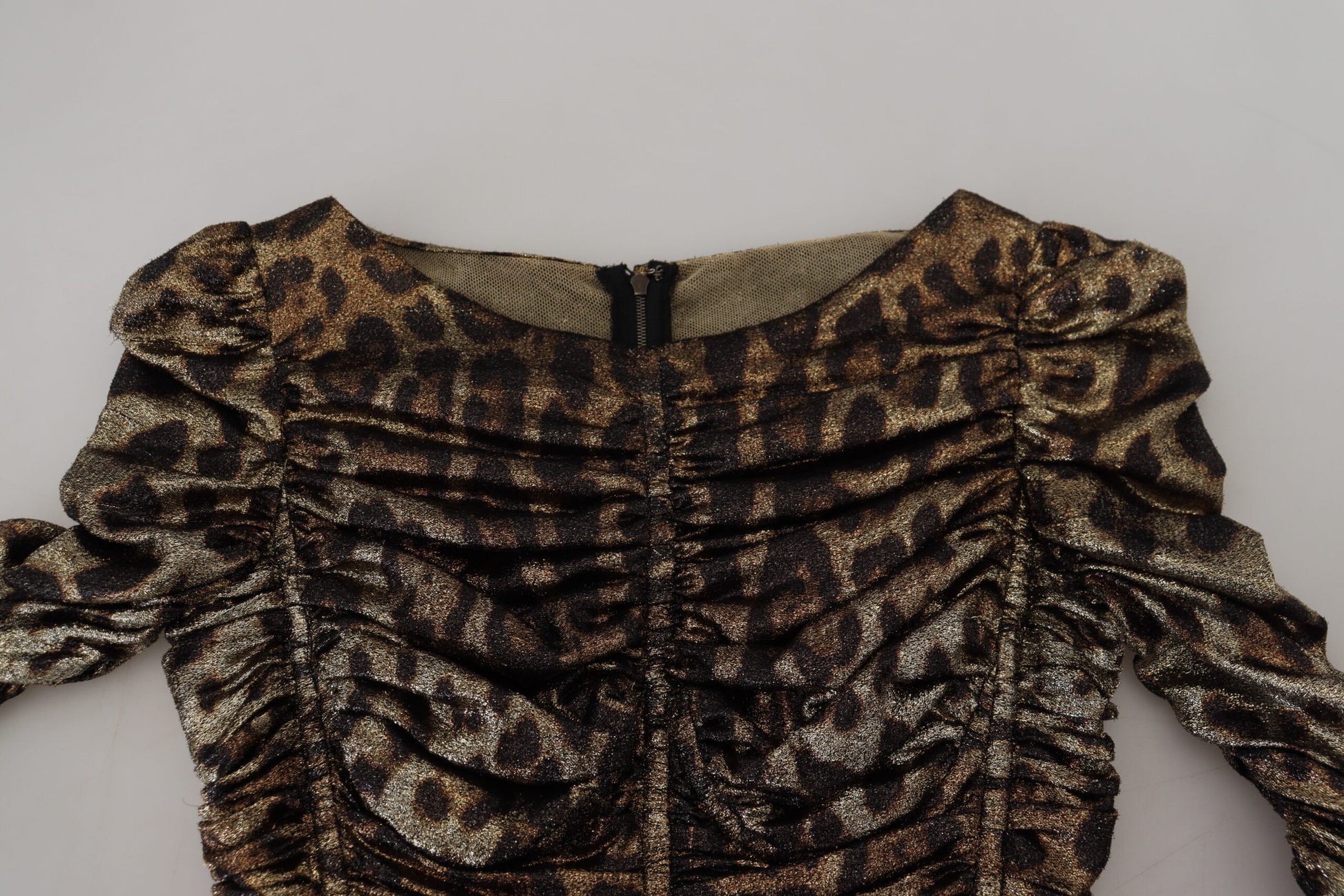 A midi dress with a leopard print pattern and sequins, featuring a body-skimming silhouette