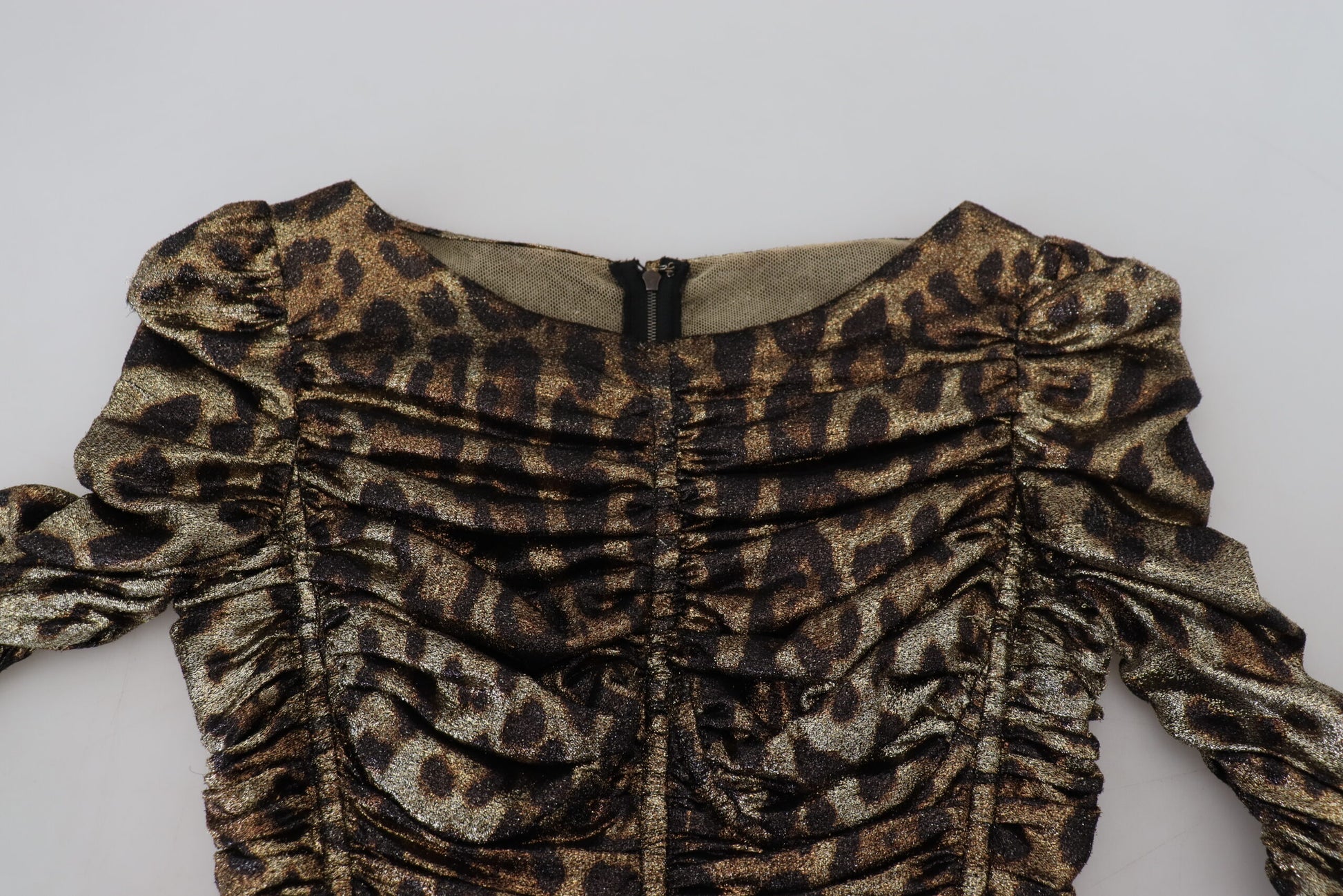 A leopard print bodycon dress with gold sequins and a midi length