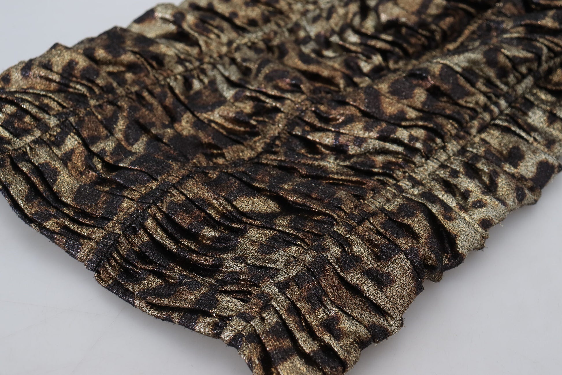 A black, gold, and brown leopard print bodycon sheath midi dress