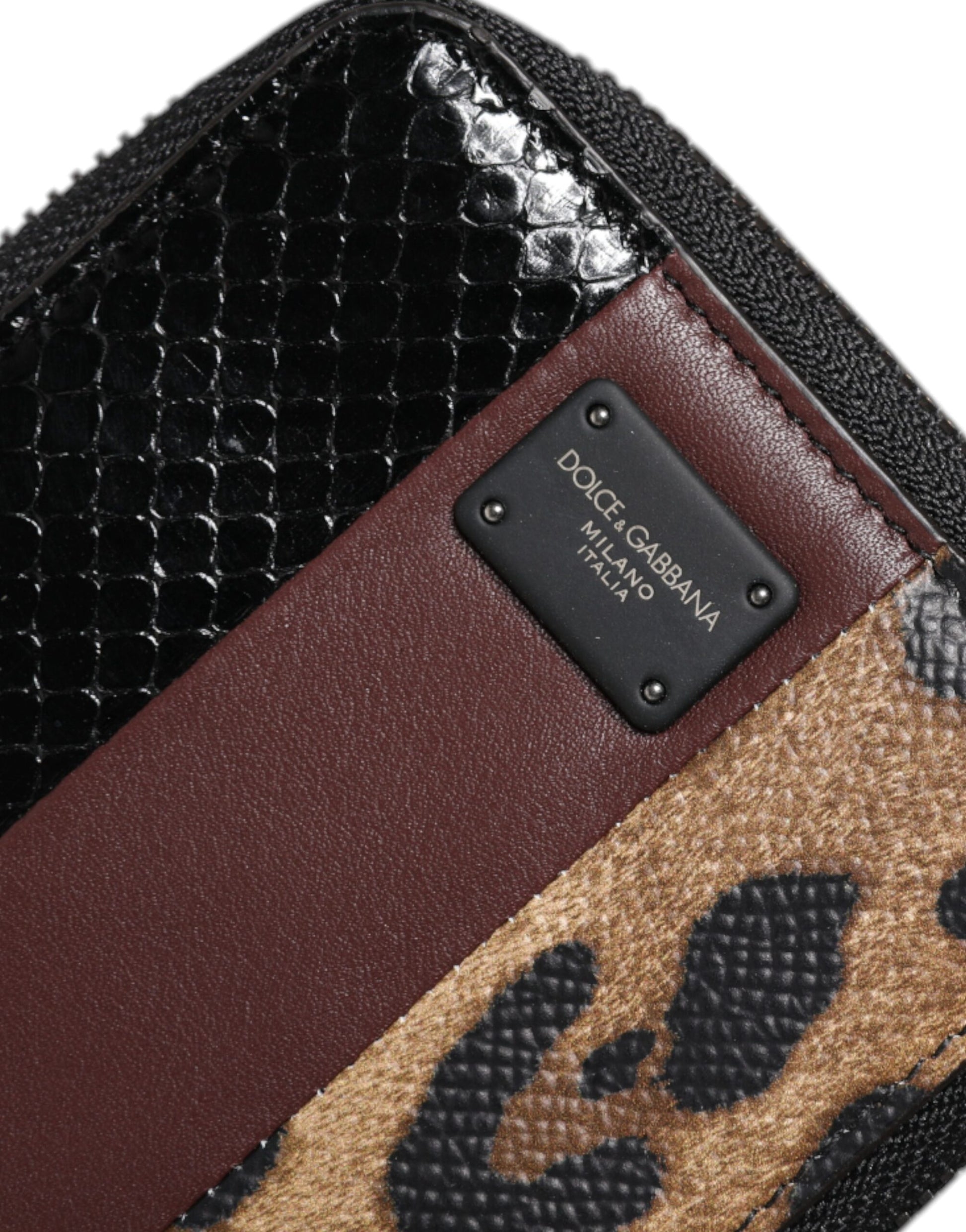 Brown leather wallet with gold accents and a cheetah print pattern on one side