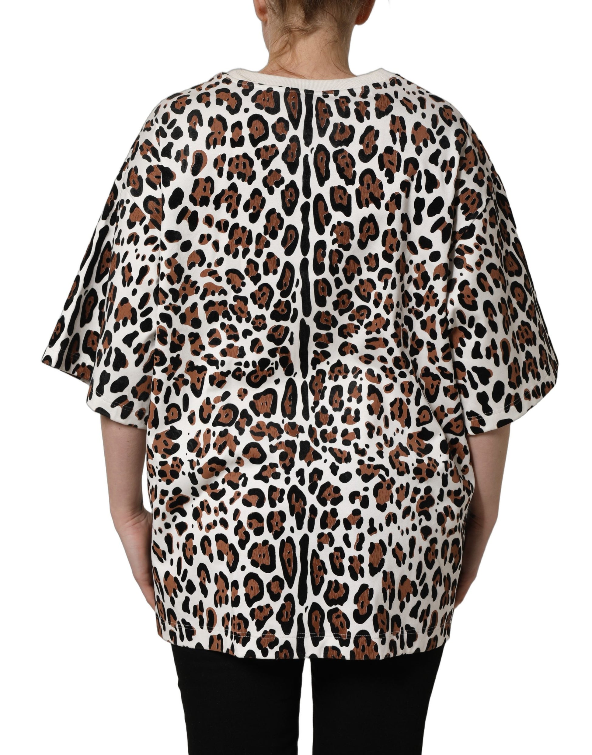 A woman wearing a leopard print crew neck t-shirt