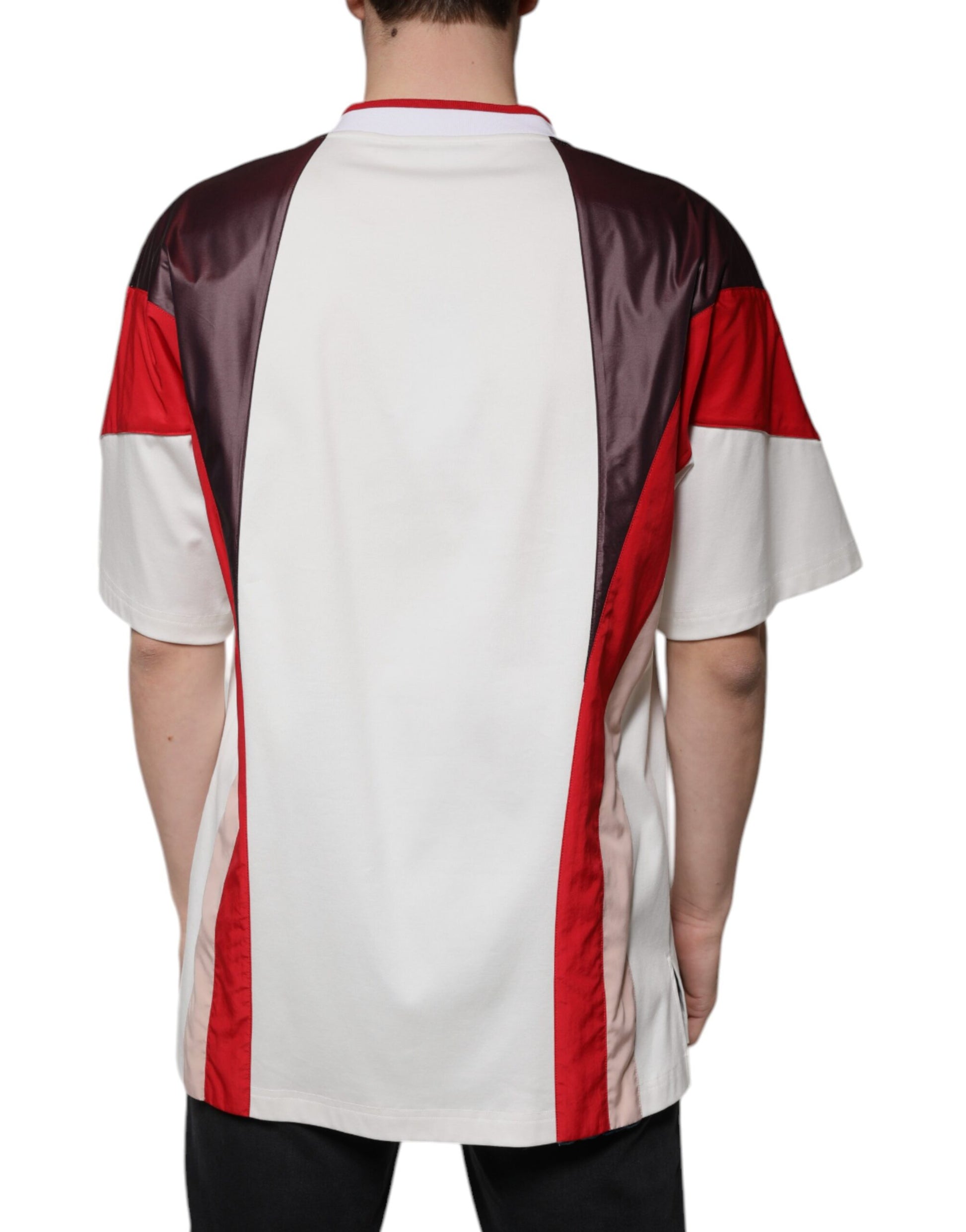 The back view of a man wearing a sports jersey with red, white, and blue stripes