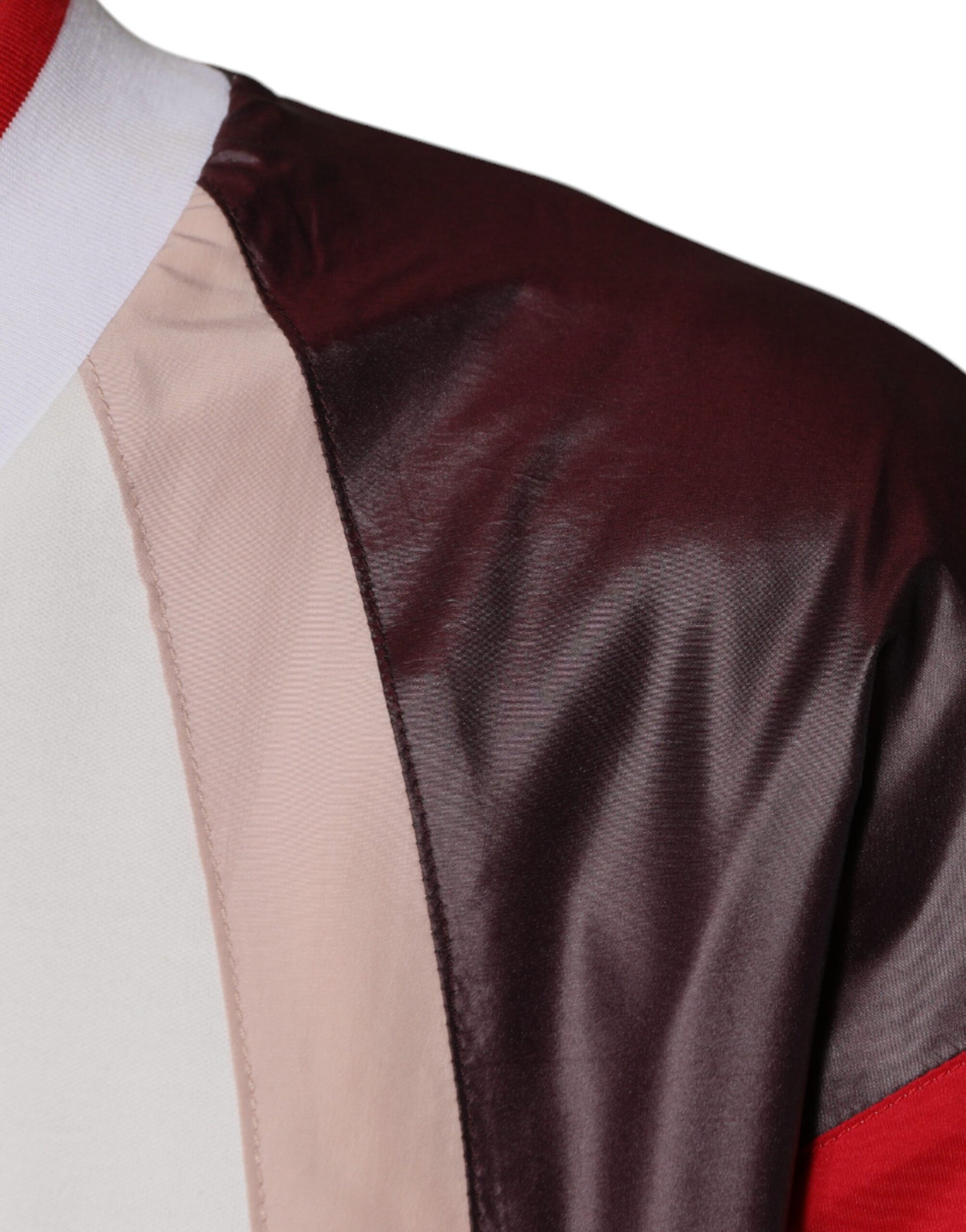 The garment is a graduation gown with a hood on the back
