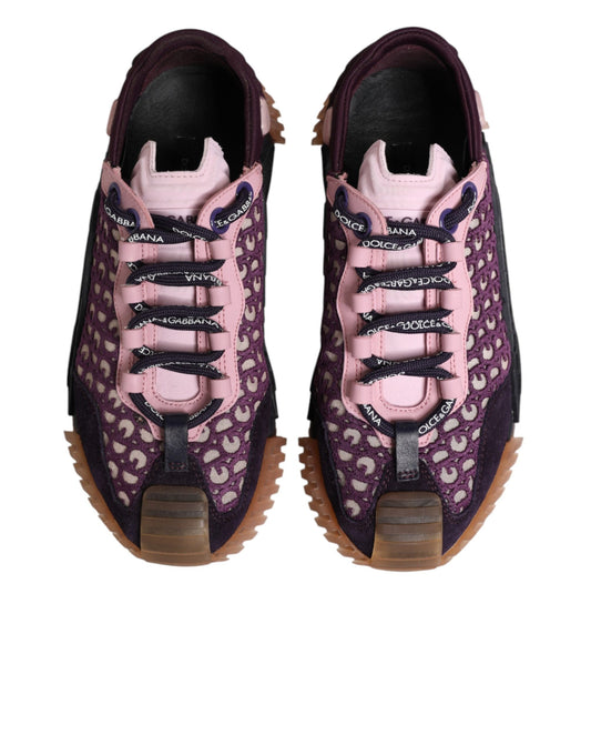 Pair of purple sneakers with pink laces and patterned design
