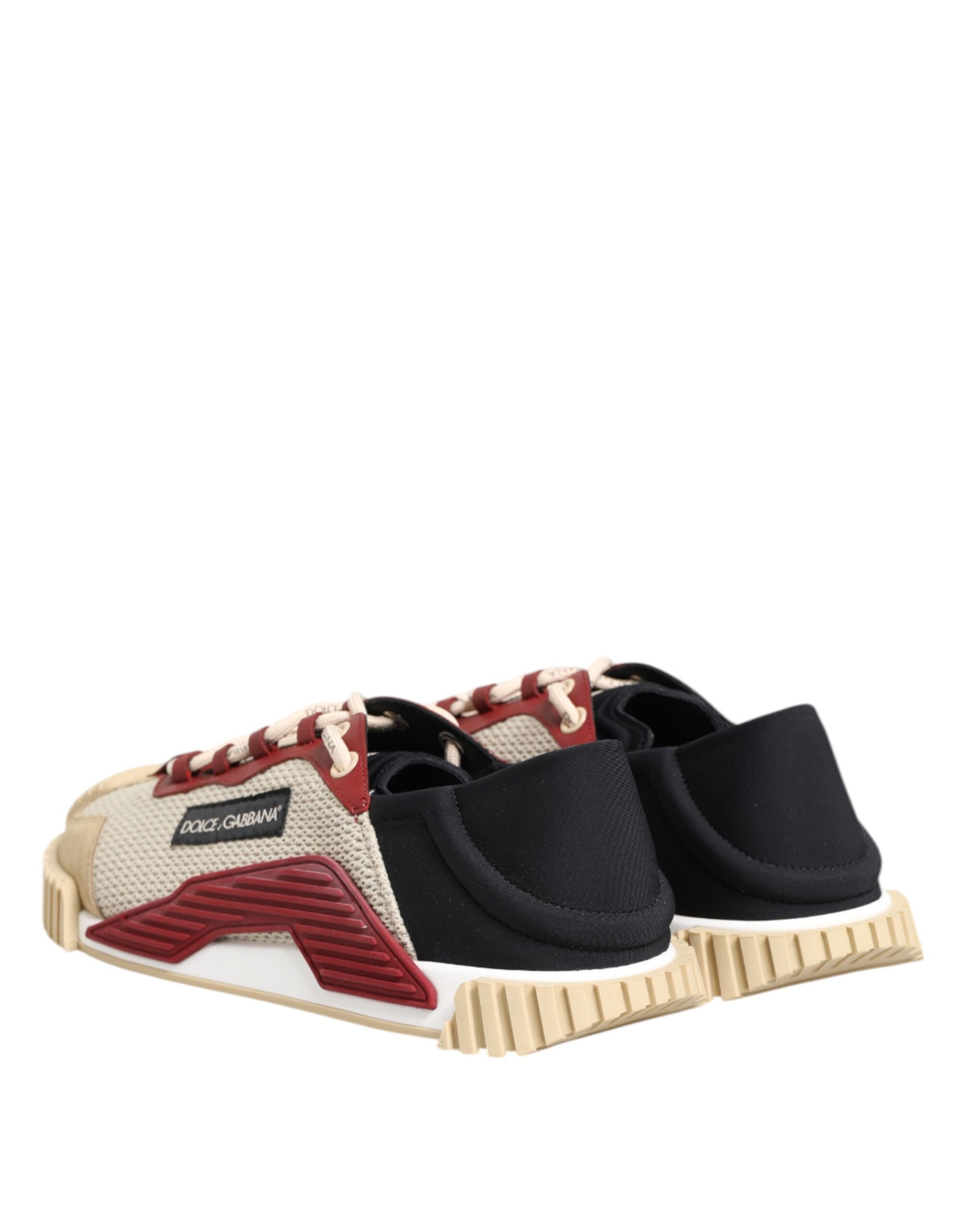 Pair of men's sneakers with red and white laces, black straps, and a tan sole