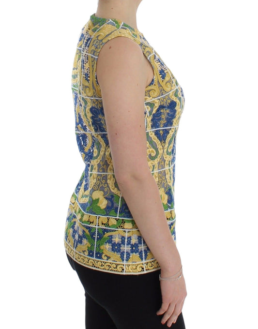 The back view of a woman wearing a colorful top with a floral pattern