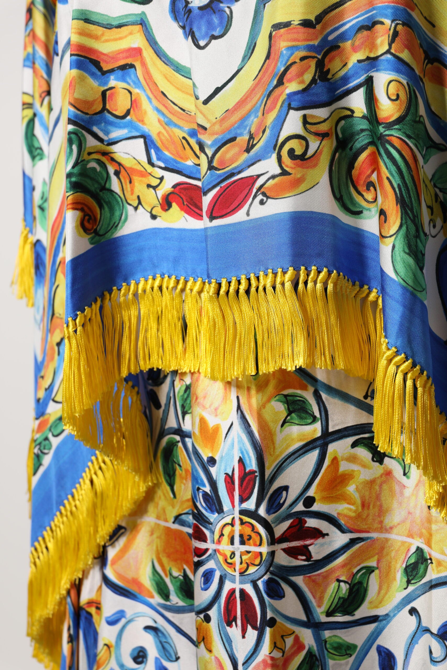 Colorful kaftan dress with fringe details and embroidered patterns