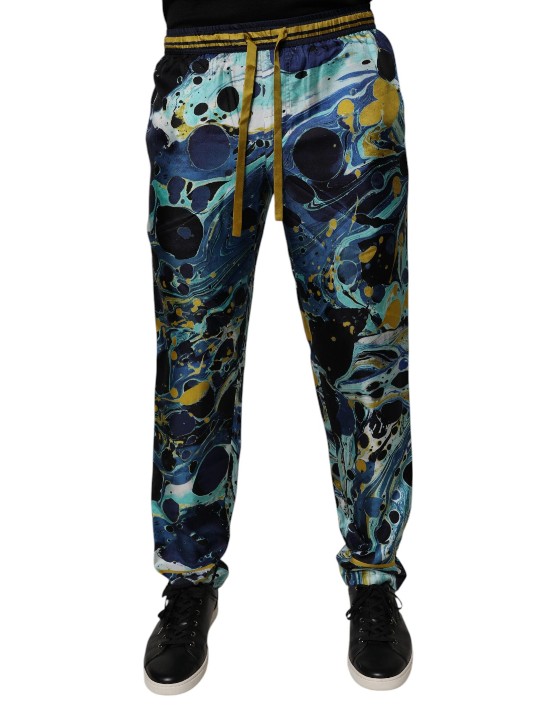 Pair of colorful pajama pants with a galaxy print