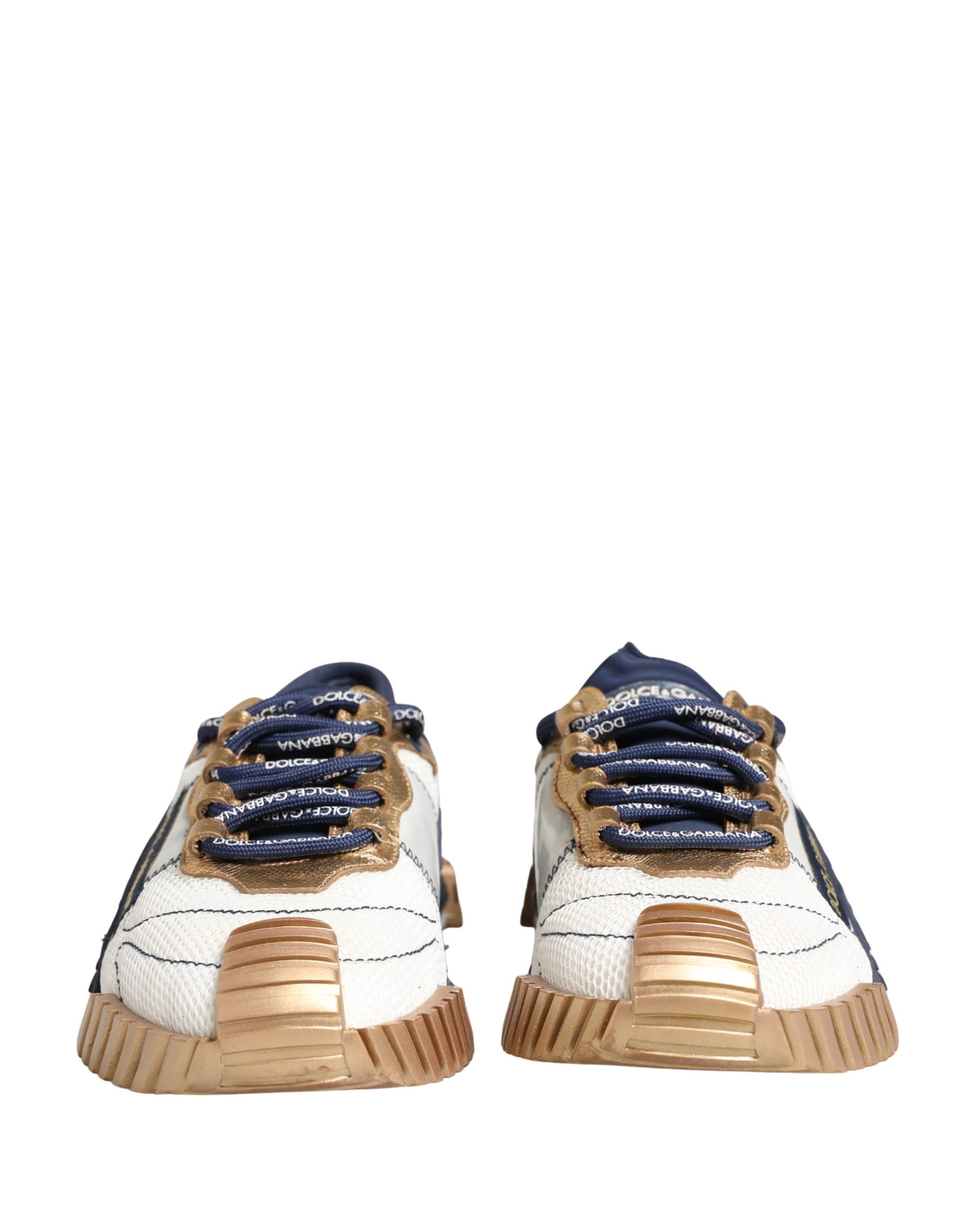 Pair of white sneakers with blue laces and gold accents