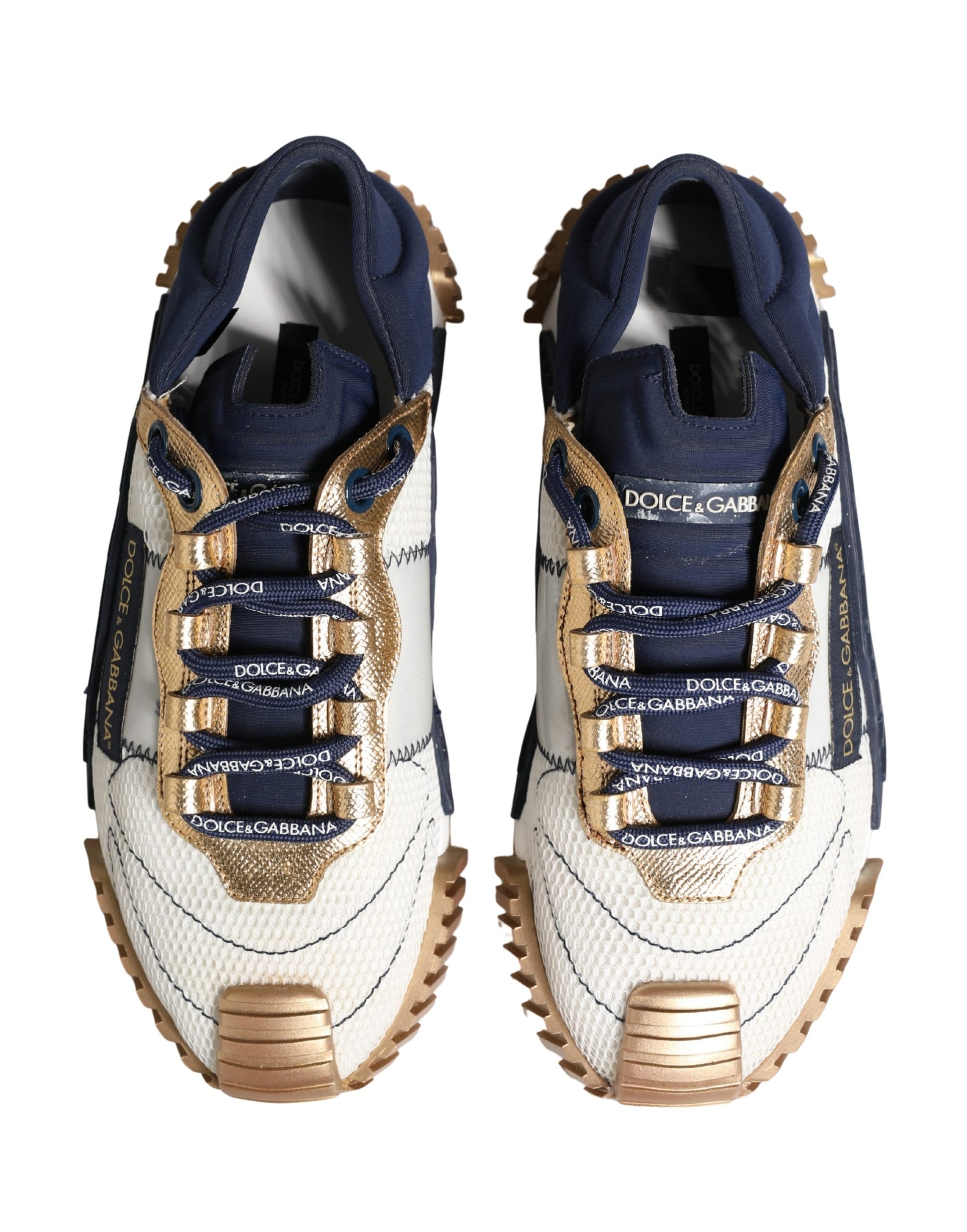 Pair of blue and white sneakers with gold accents