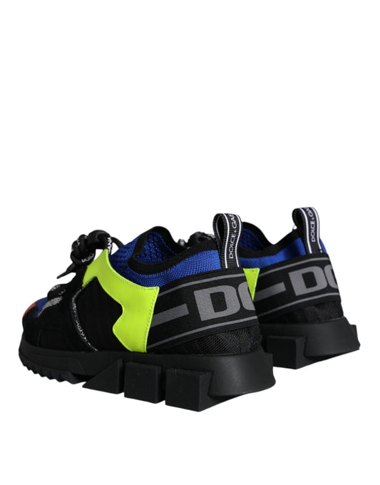 Pair of black and yellow athletic shoes with white laces