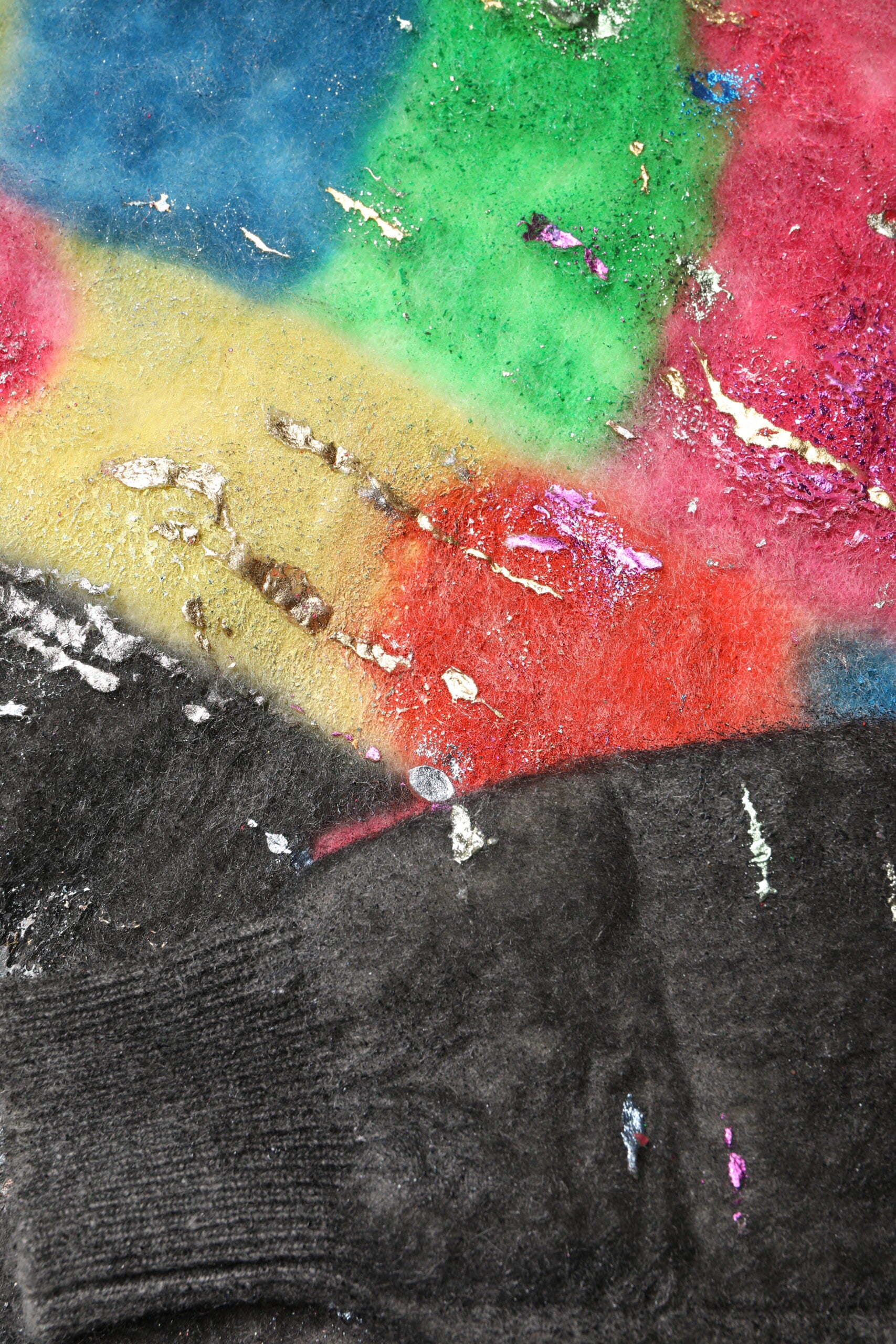 Colorful fabric with glittery paint splatters
