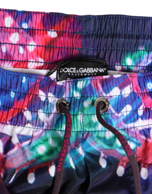 Colorful swim trunks with brand label on waistband