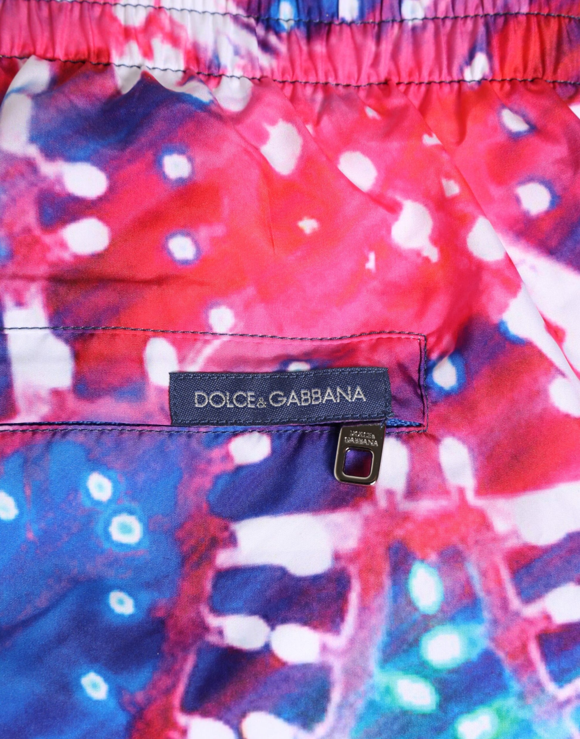 Pink and blue tie dye swimsuit with polka dot pattern