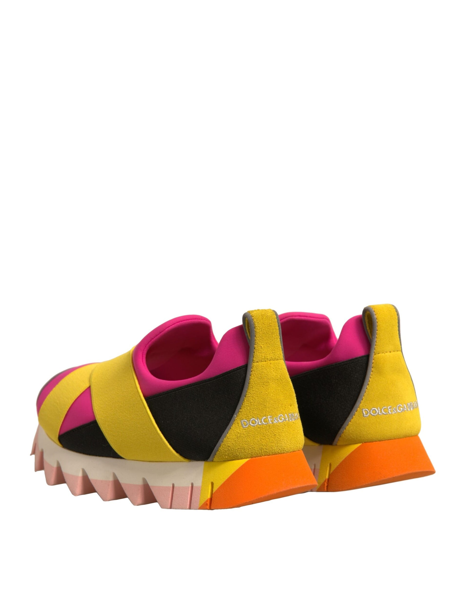 Pink yellow and black sneakers with a patterned sole
