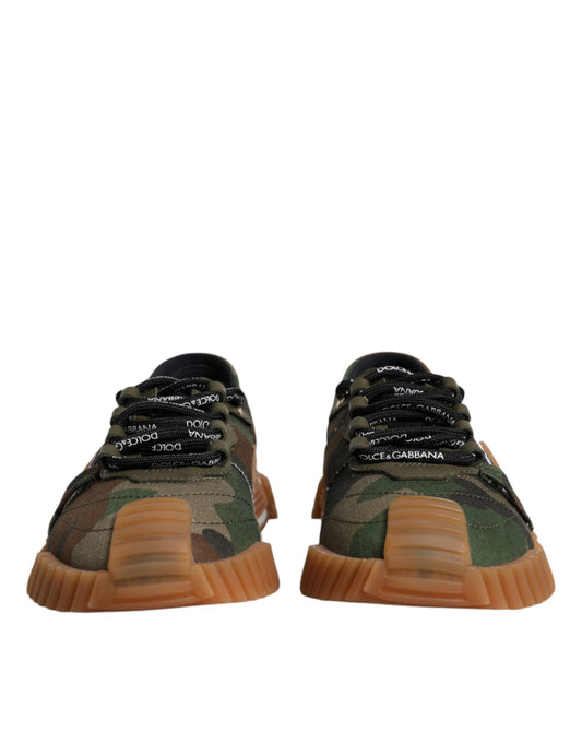 Pair of men's sneakers with camouflage pattern and orange soles