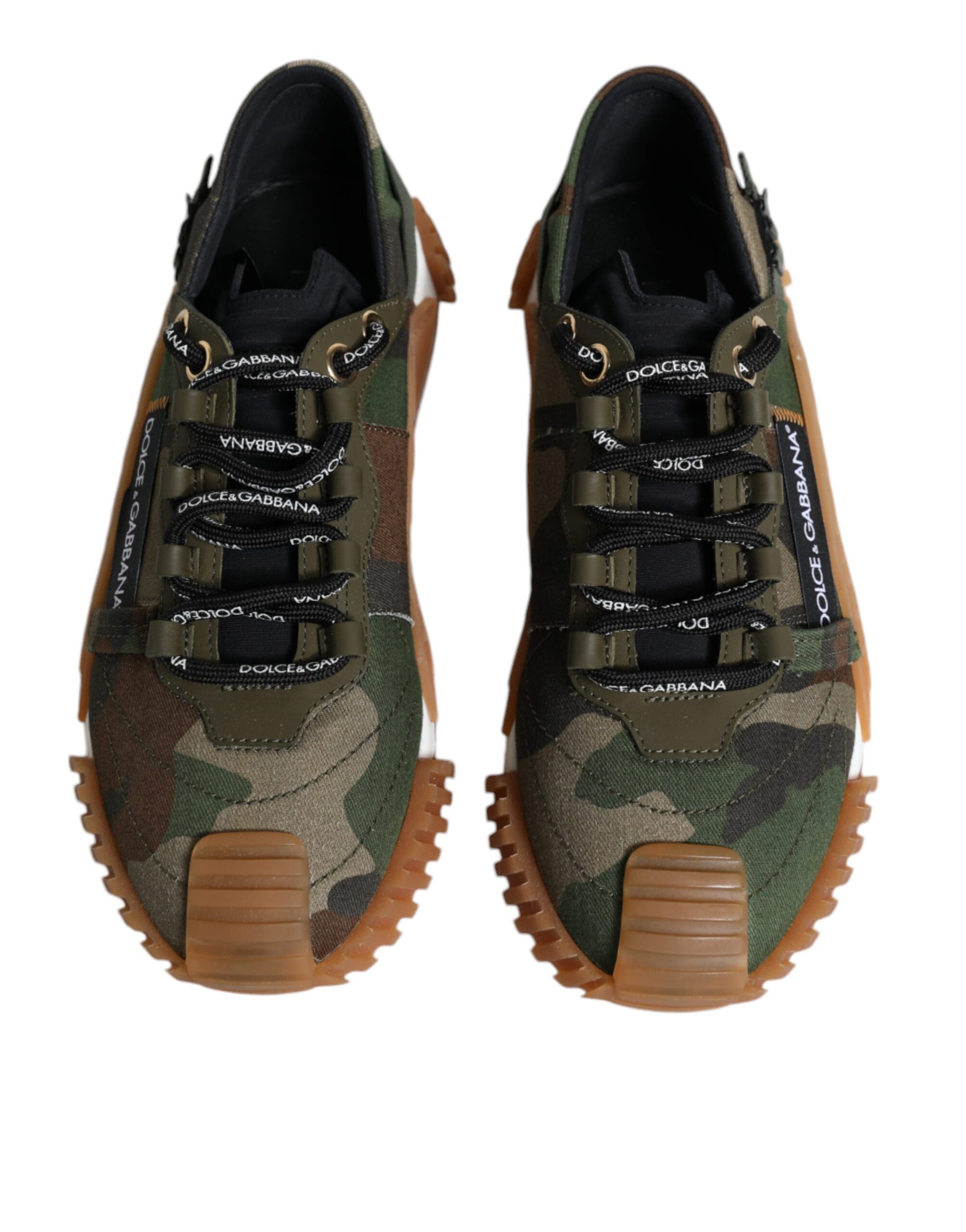 Pair of camouflage print sneakers with brown laces and soles