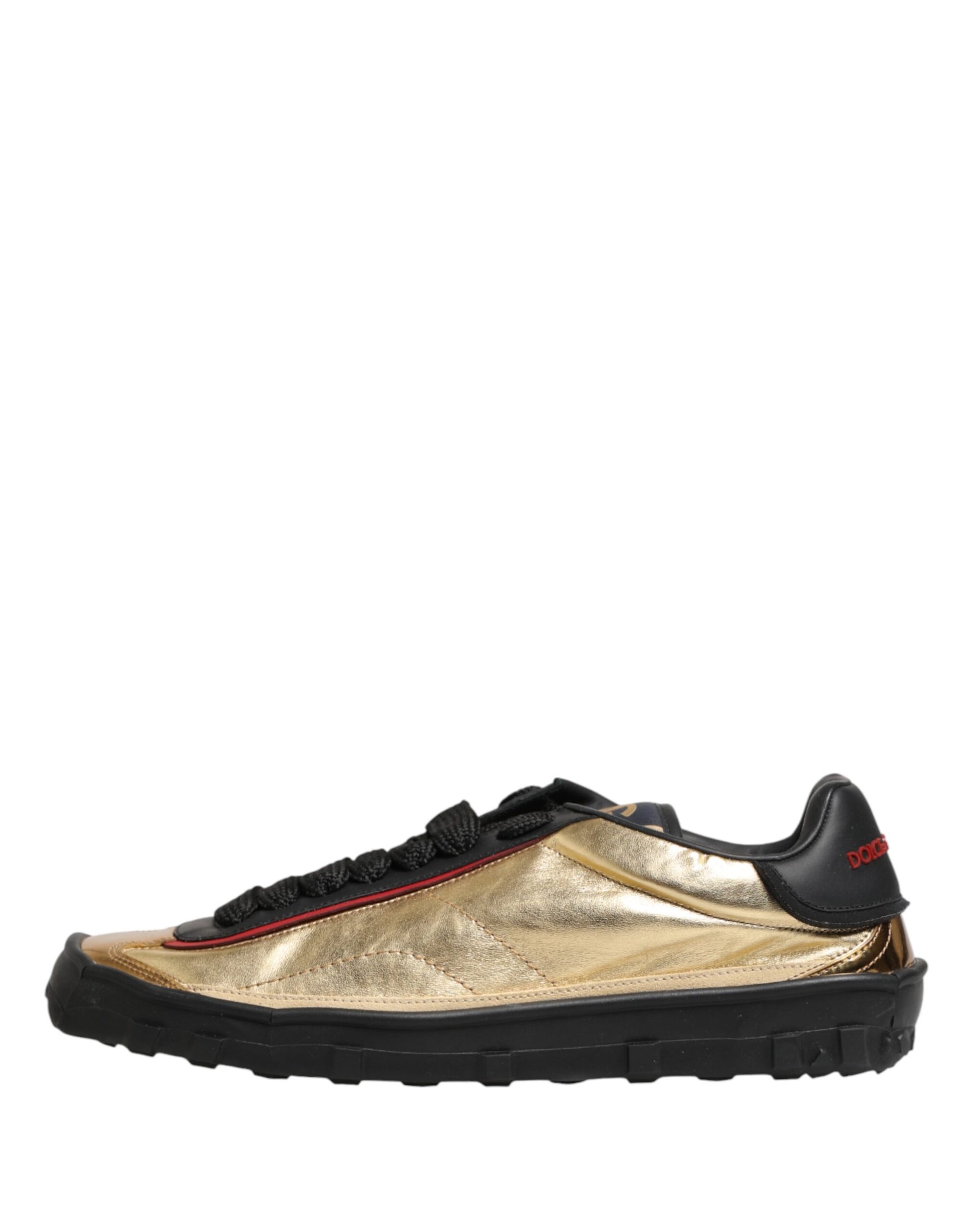 Gold lace-up sneaker with red accents, featuring a glittery texture