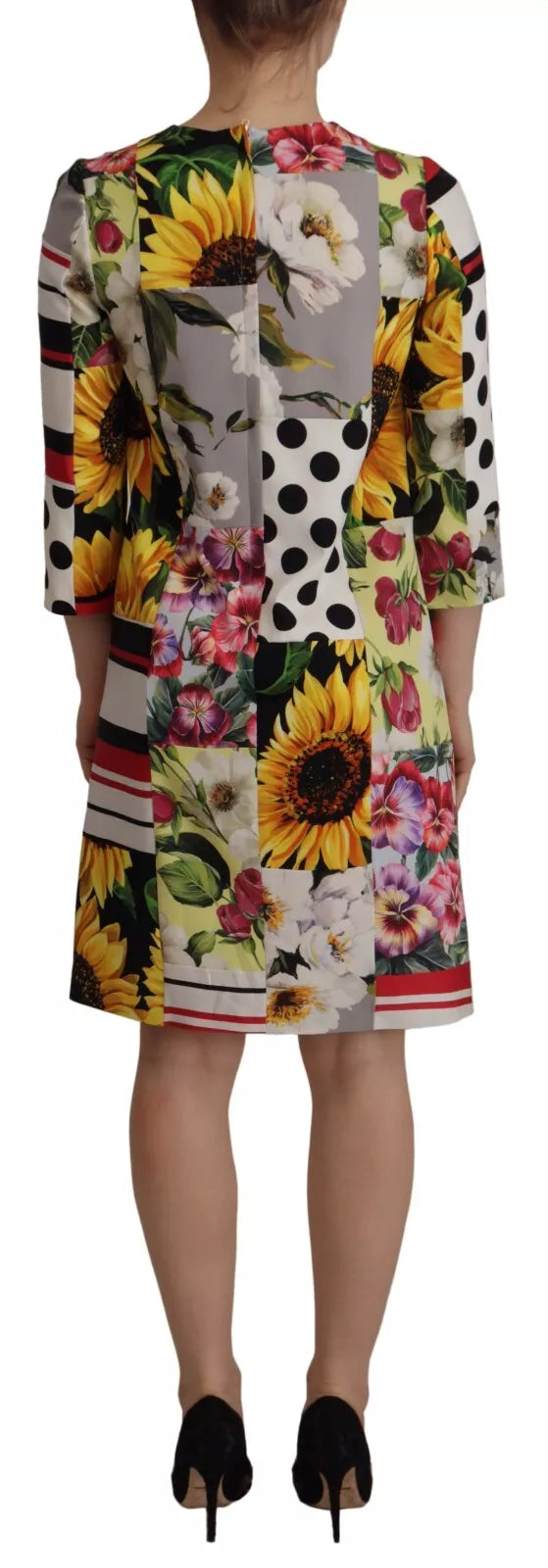 A woman's floral print dress with a paisley pattern and a high neckline