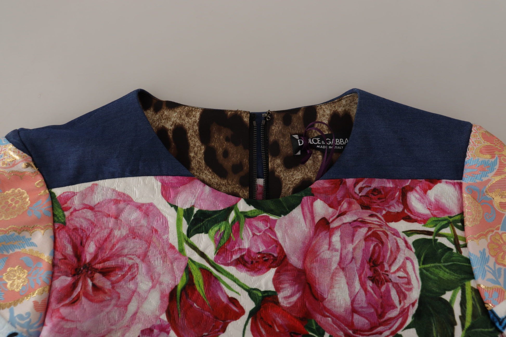 A multicolored floral sheath dress with a pachwork pattern