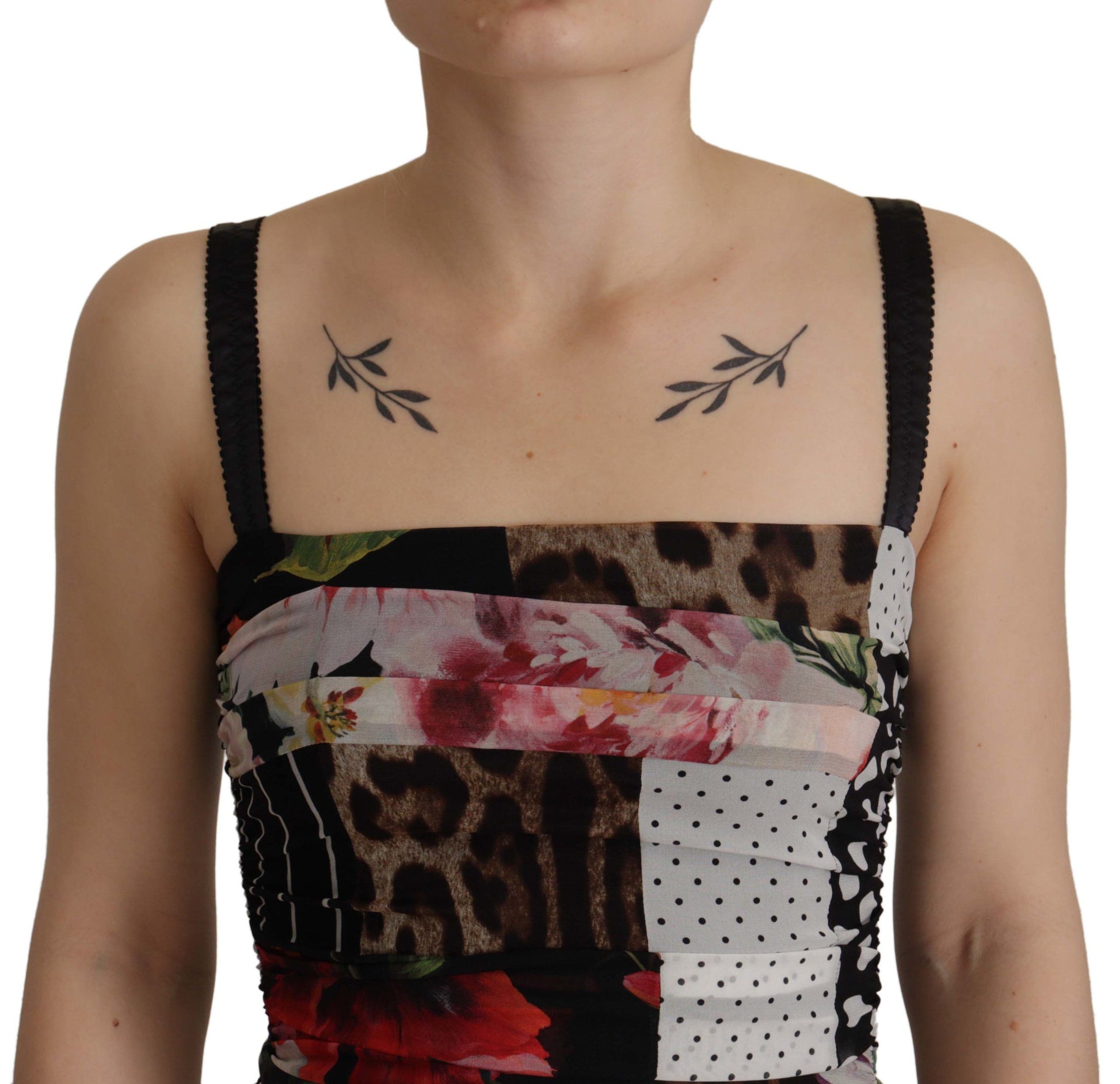 A woman wearing a multicolored pachwork midi floral silk leopard bodycon dress