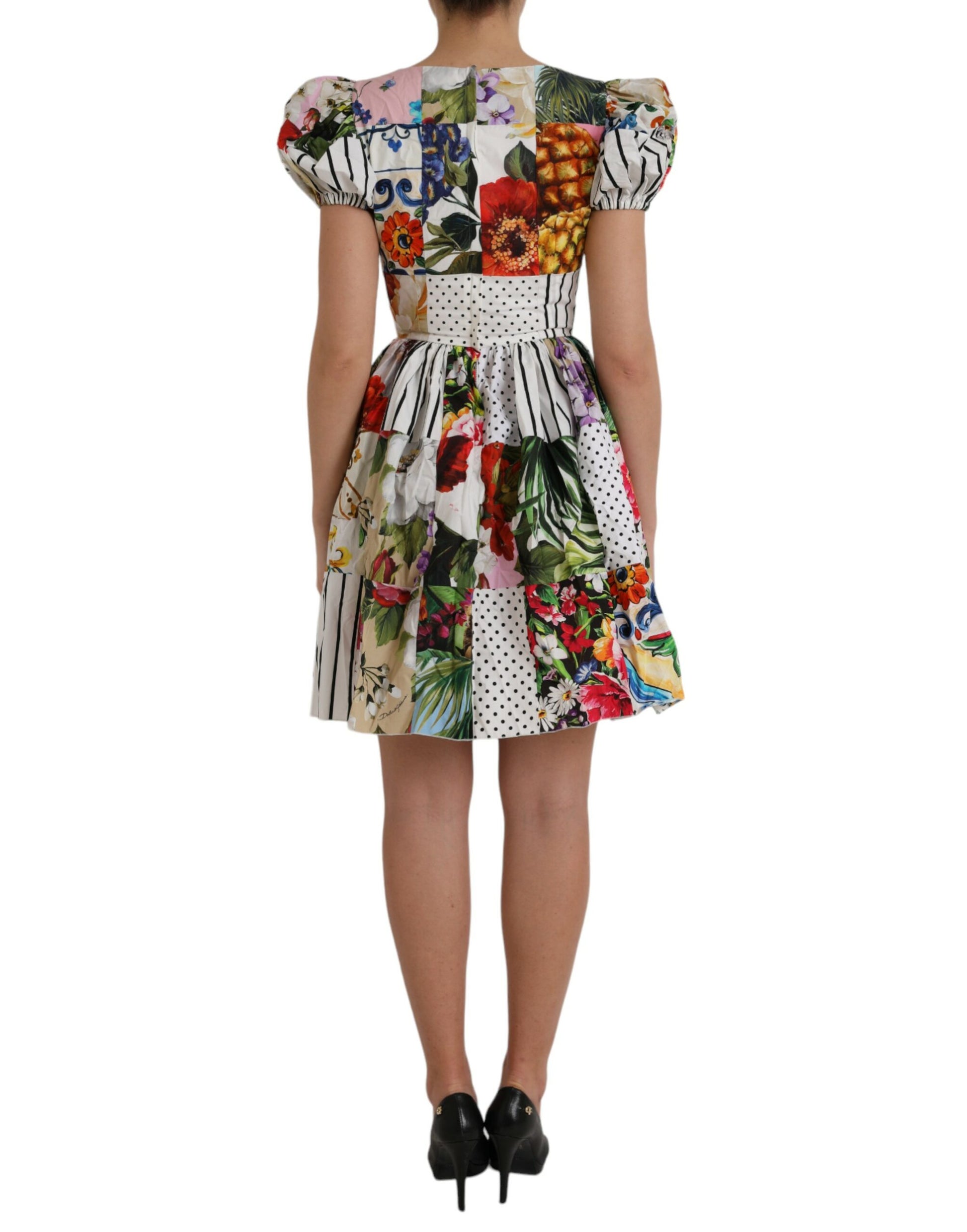 A colorful, floral patterned mini dress with a polka dot waistband