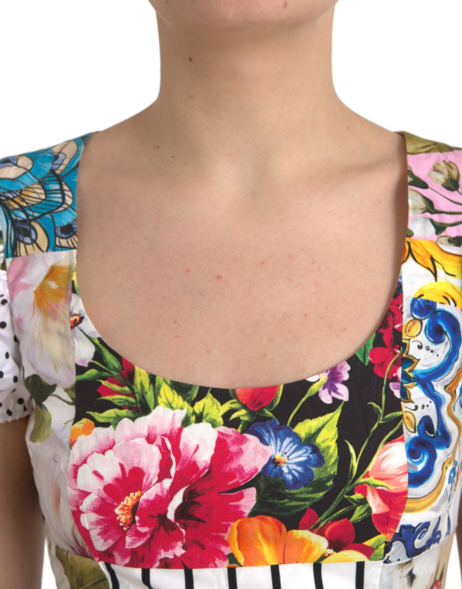 A colorful floral print dress with a V-neckline and short sleeves