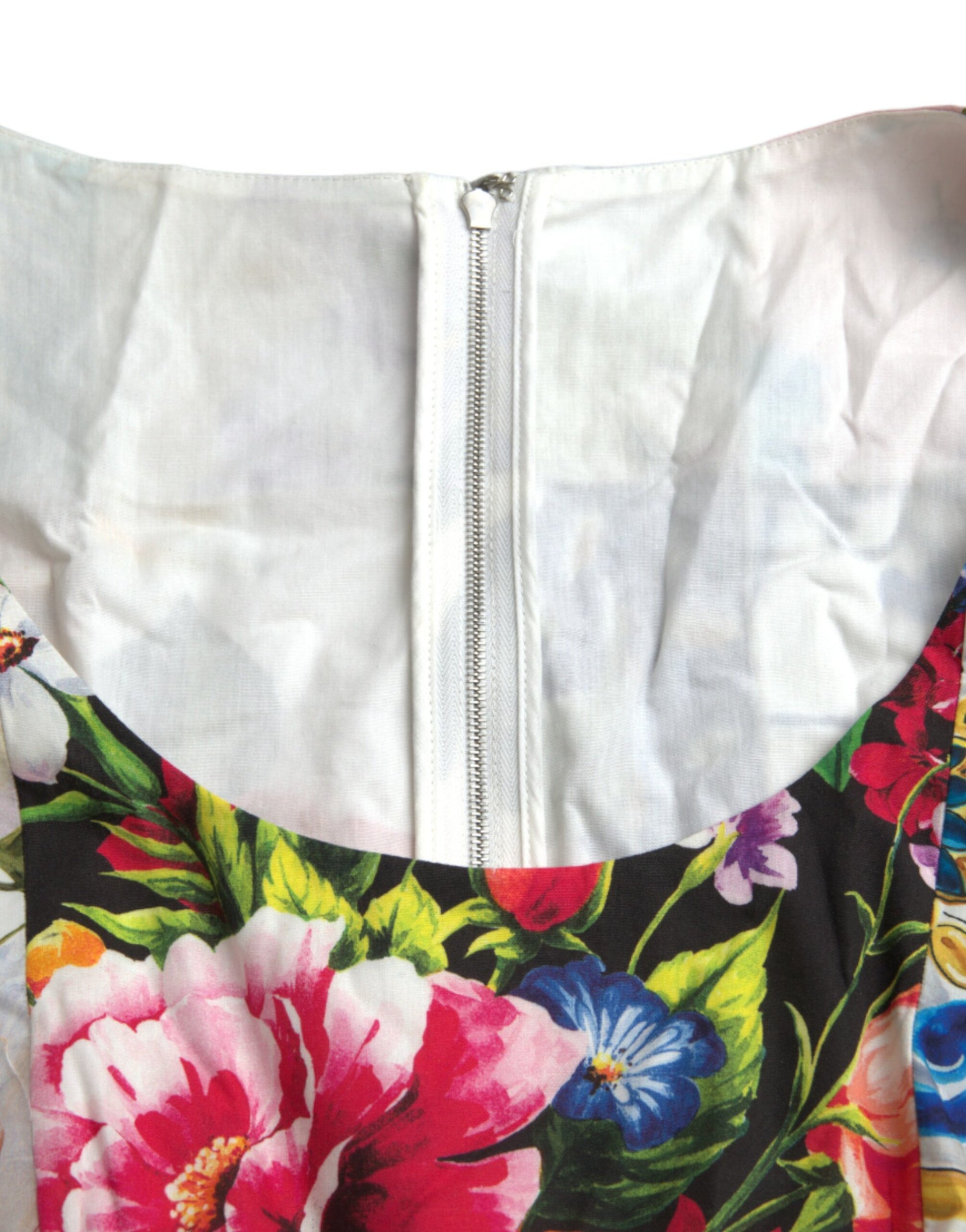 A colorful floral print dress with a zippered front and short sleeves