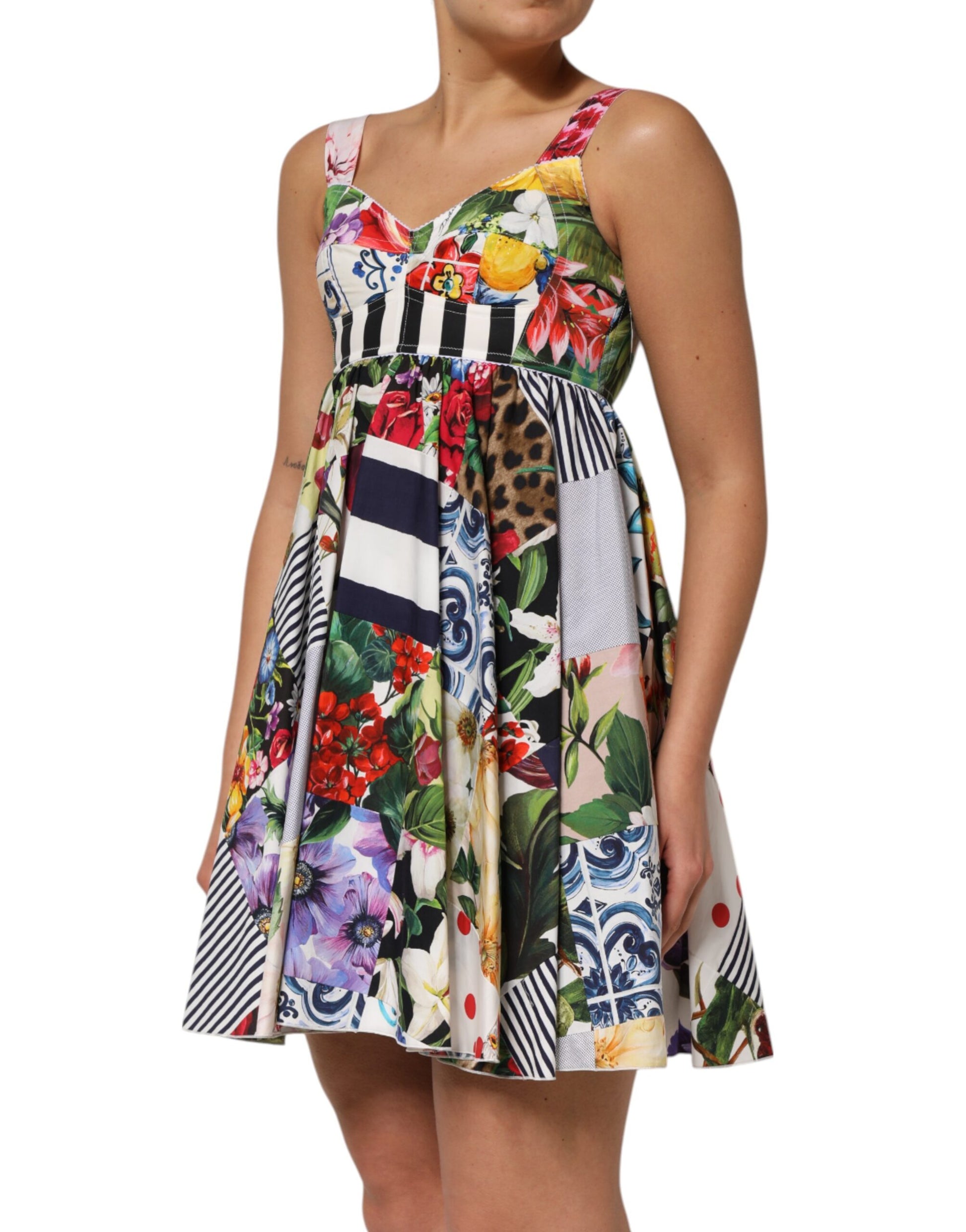 A colorful, floral print dress with a patchwork design and short sleeves