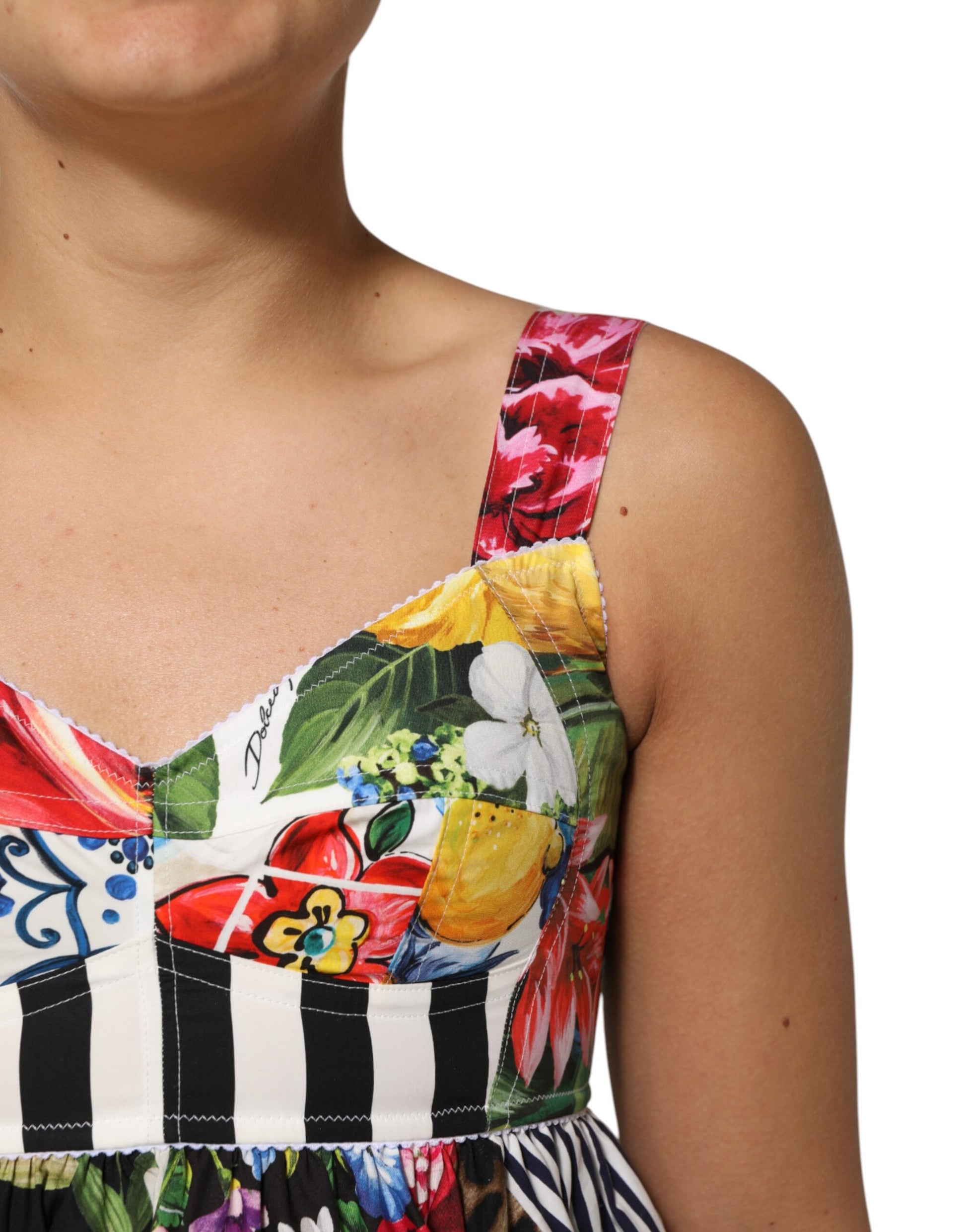 A colorful, floral patterned dress with a halter neckline and short sleeves