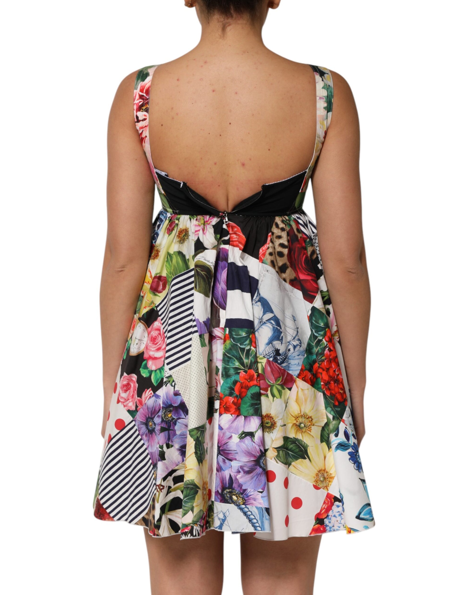 A colorful, floral patterned dress with a black waistband and short sleeves
