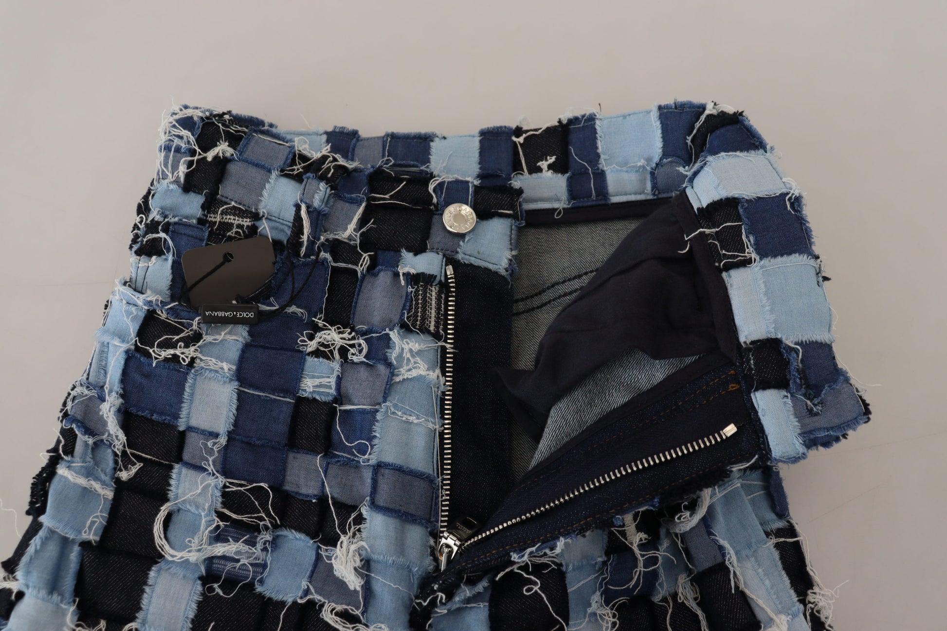 Blue denim shorts with zippered pockets