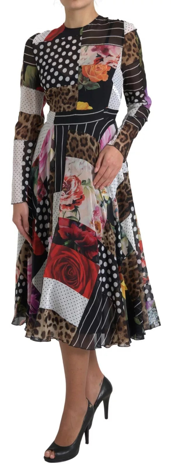 A woman wearing a multicolored patchwork floral leopard print dress with long sleeves and a high neckline