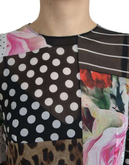 A dress with a patchwork design featuring floral and leopard prints, in shades of pink, red, green, black, and white