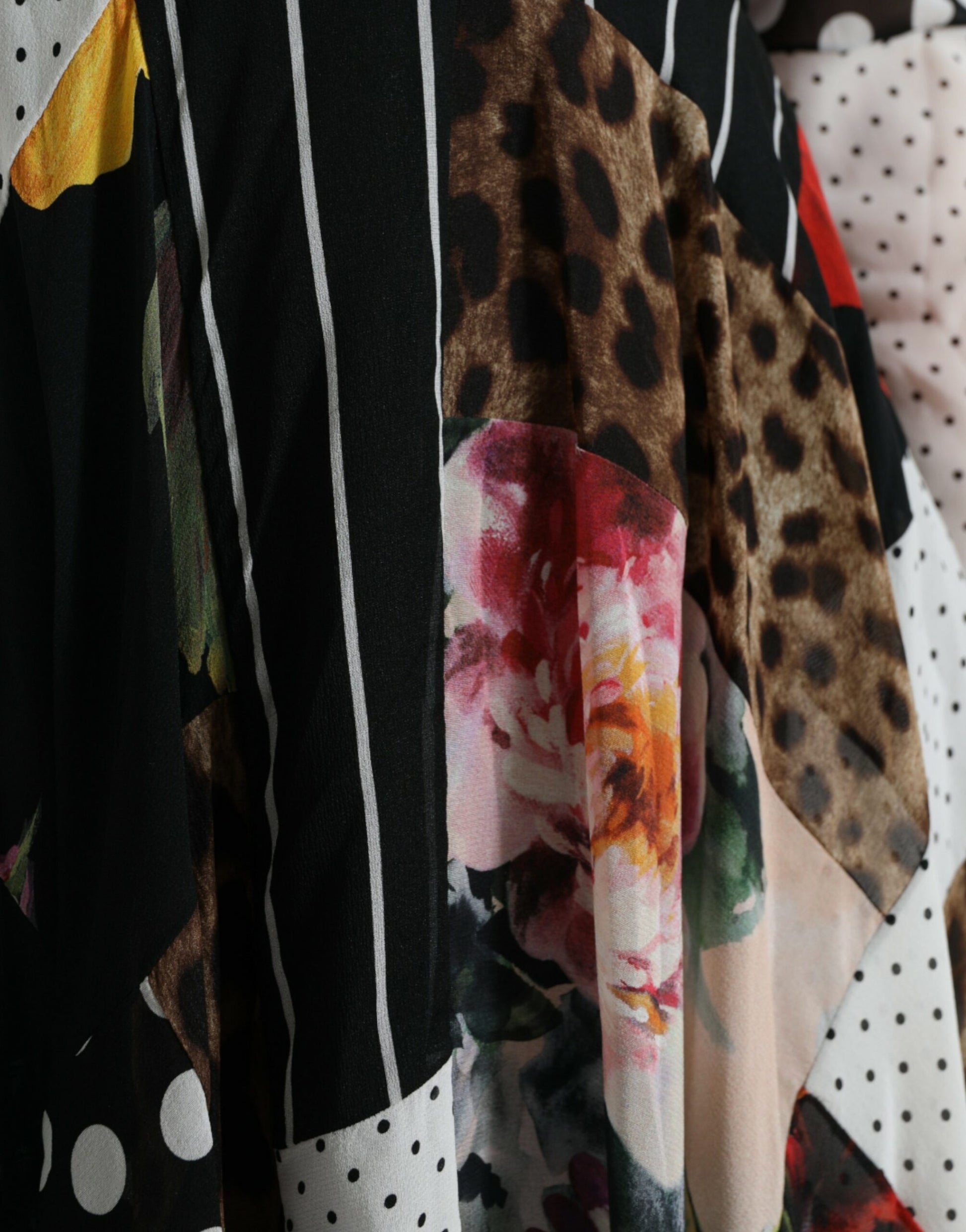 A multicolored patchwork dress with floral and leopard print patterns