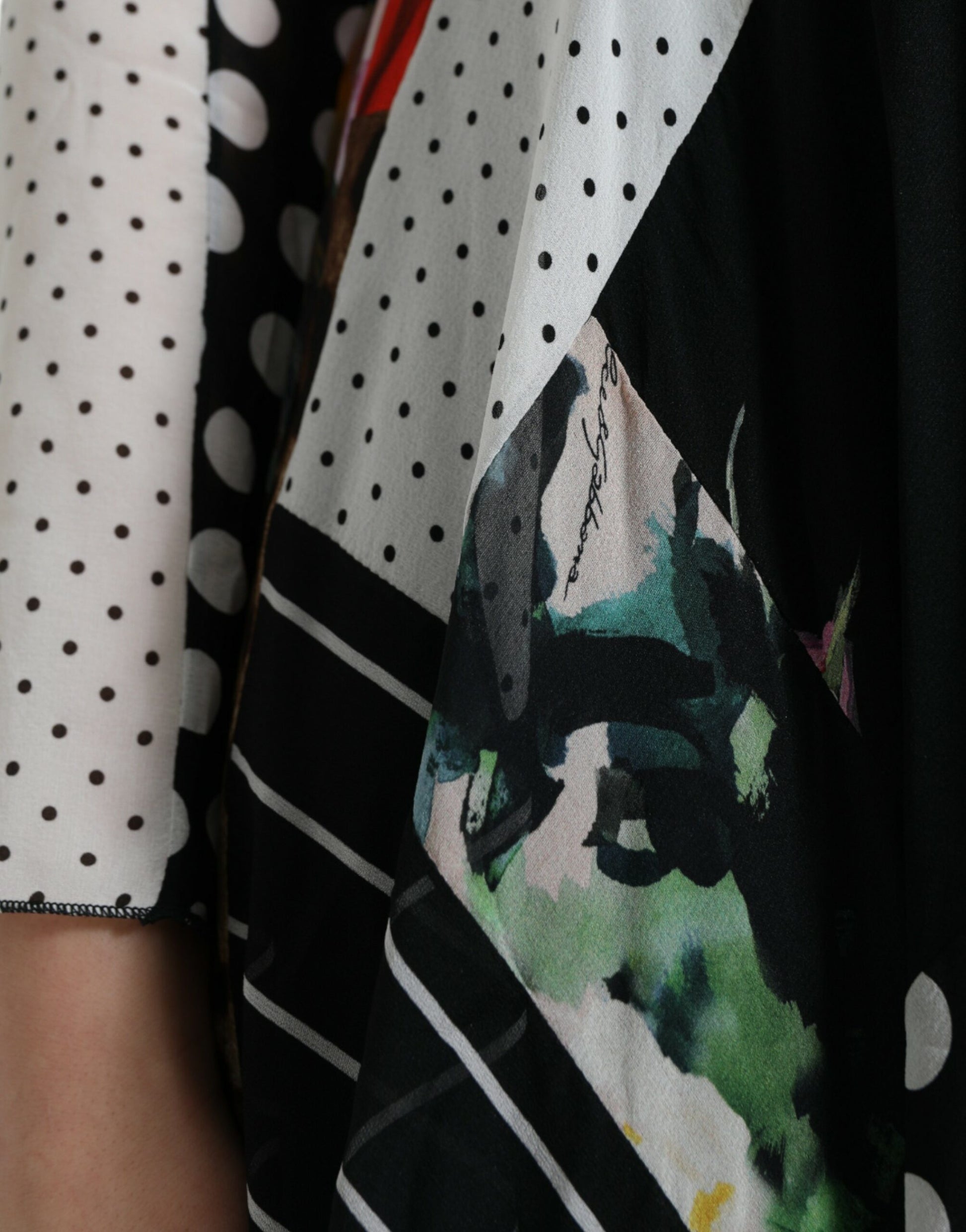 A colorful dress with a floral pattern, leopard print, and patchwork design