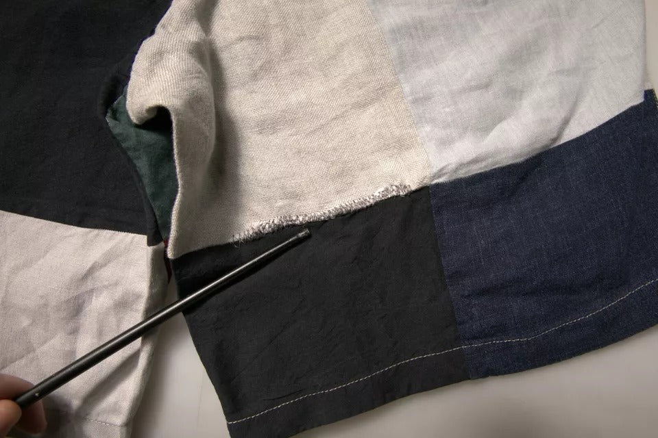 A pair of multicolored patchwork linen men's chino shorts with visible stitching