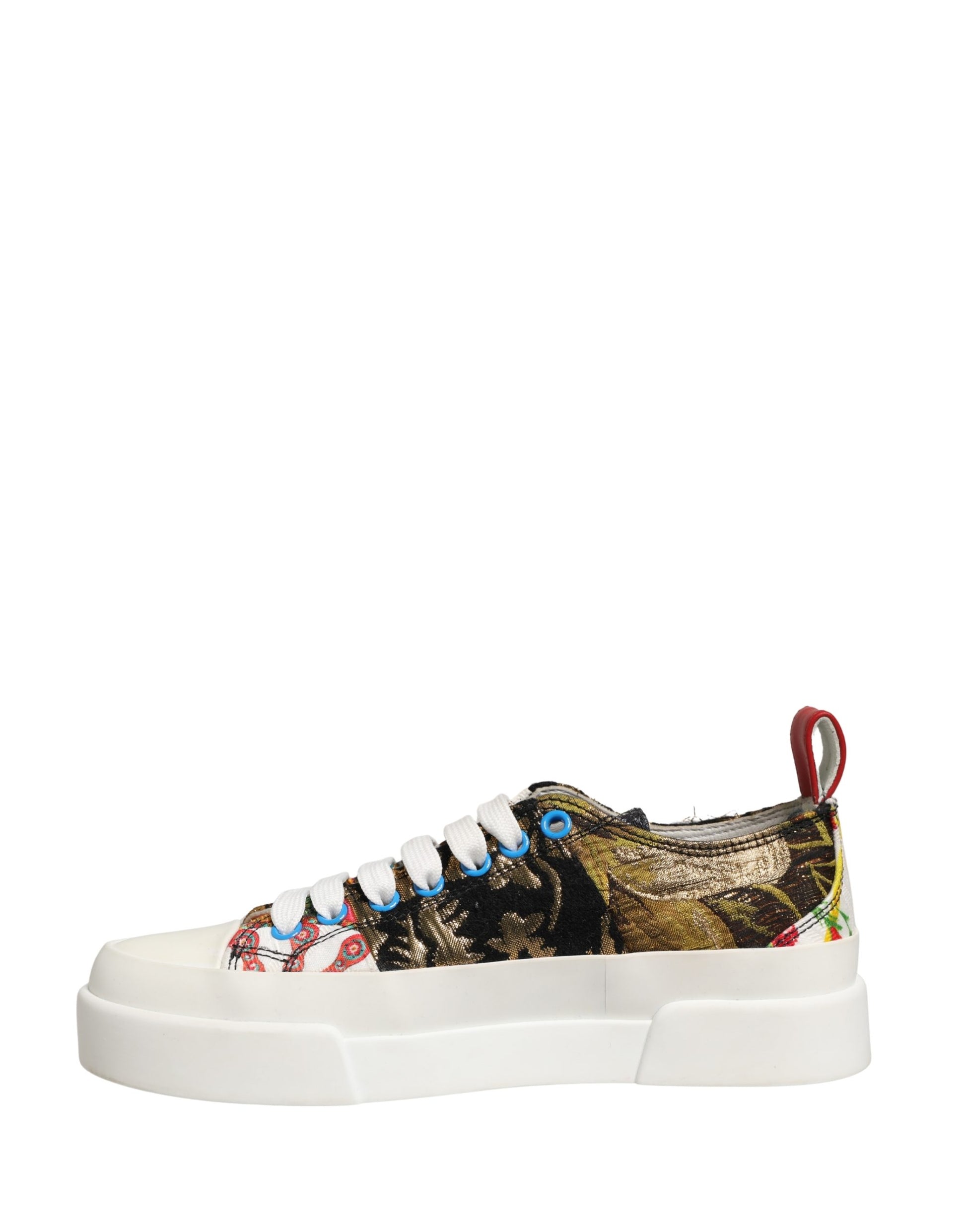 A pair of multicolored patchwork sneakers with a low top, featuring a design that includes various patterns and colors