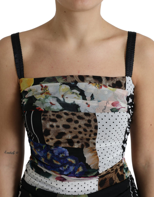 A woman wearing a multicolored patchwork midi dress with floral and leopard prints