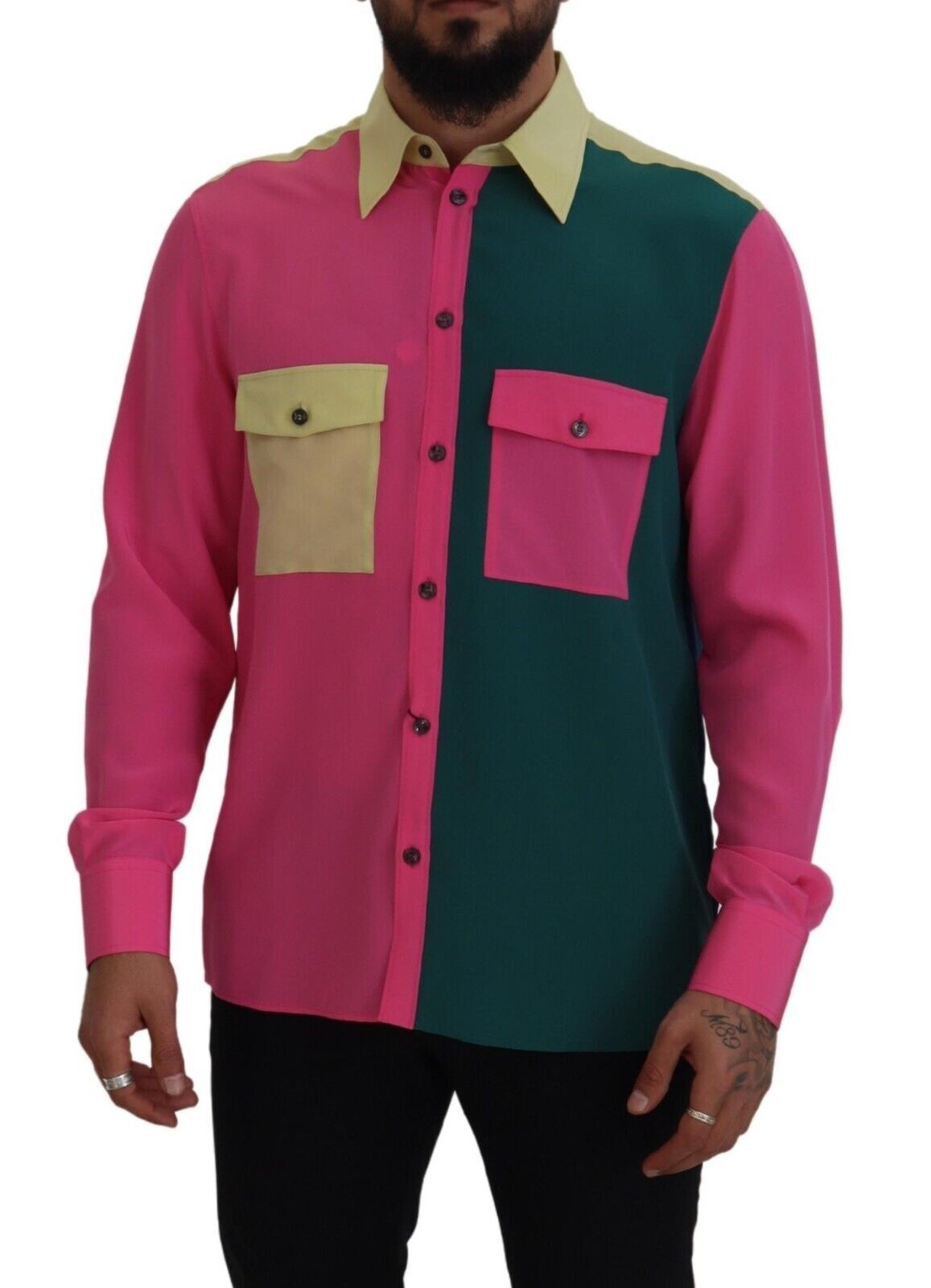 Man wearing pink shirt with green and yellow patches on sleeves