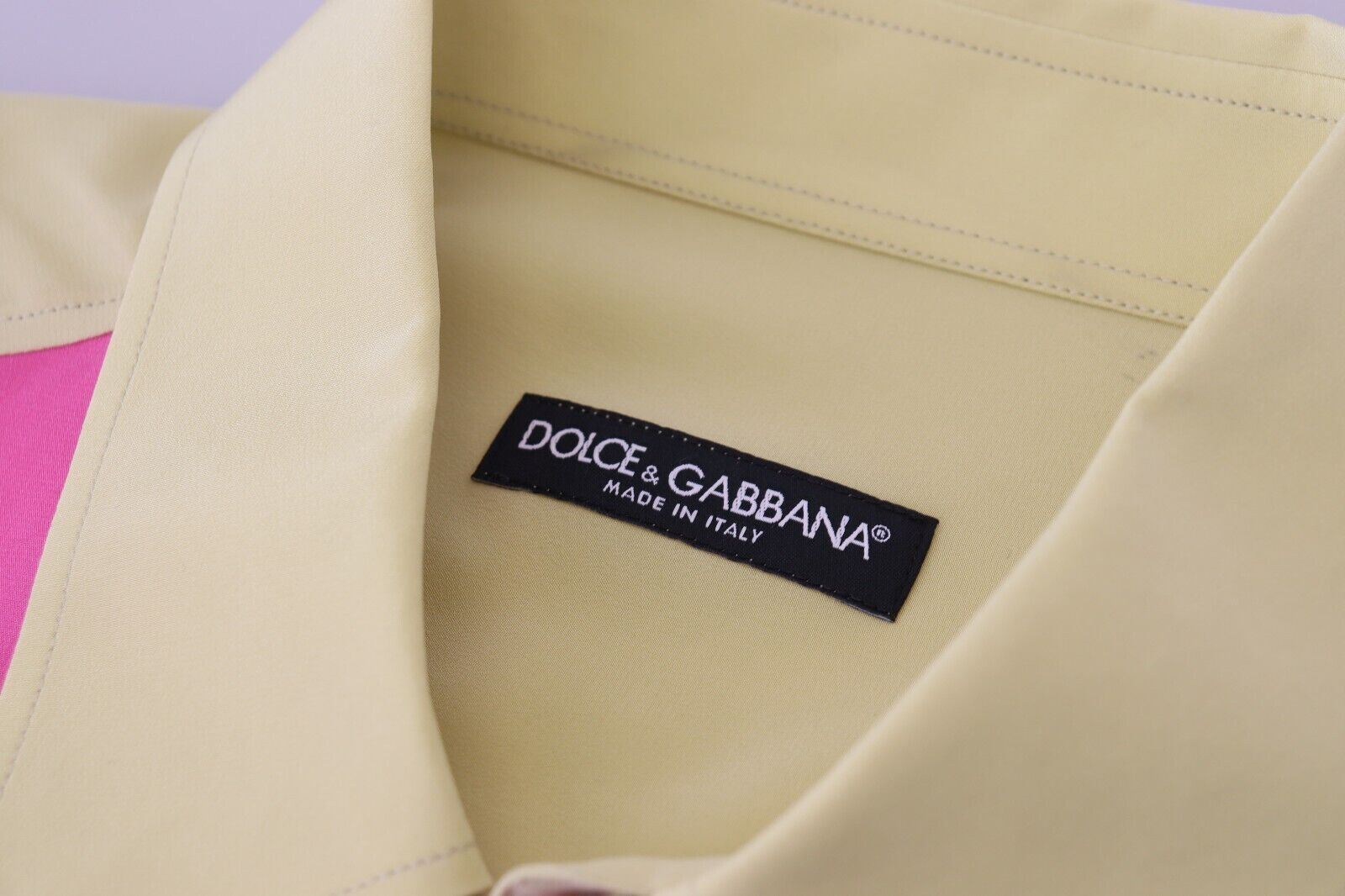 Yellow shirt on hanger with black label