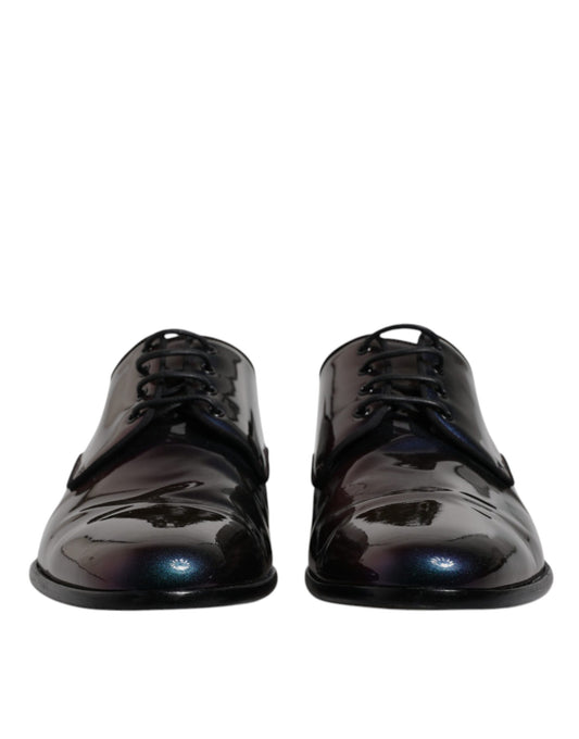 Pair of black patent leather dress shoes with laces and a peacock feather design