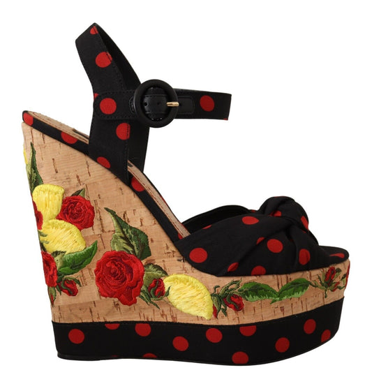 Black high heel shoe with red polka dots and a floral design on the vamp